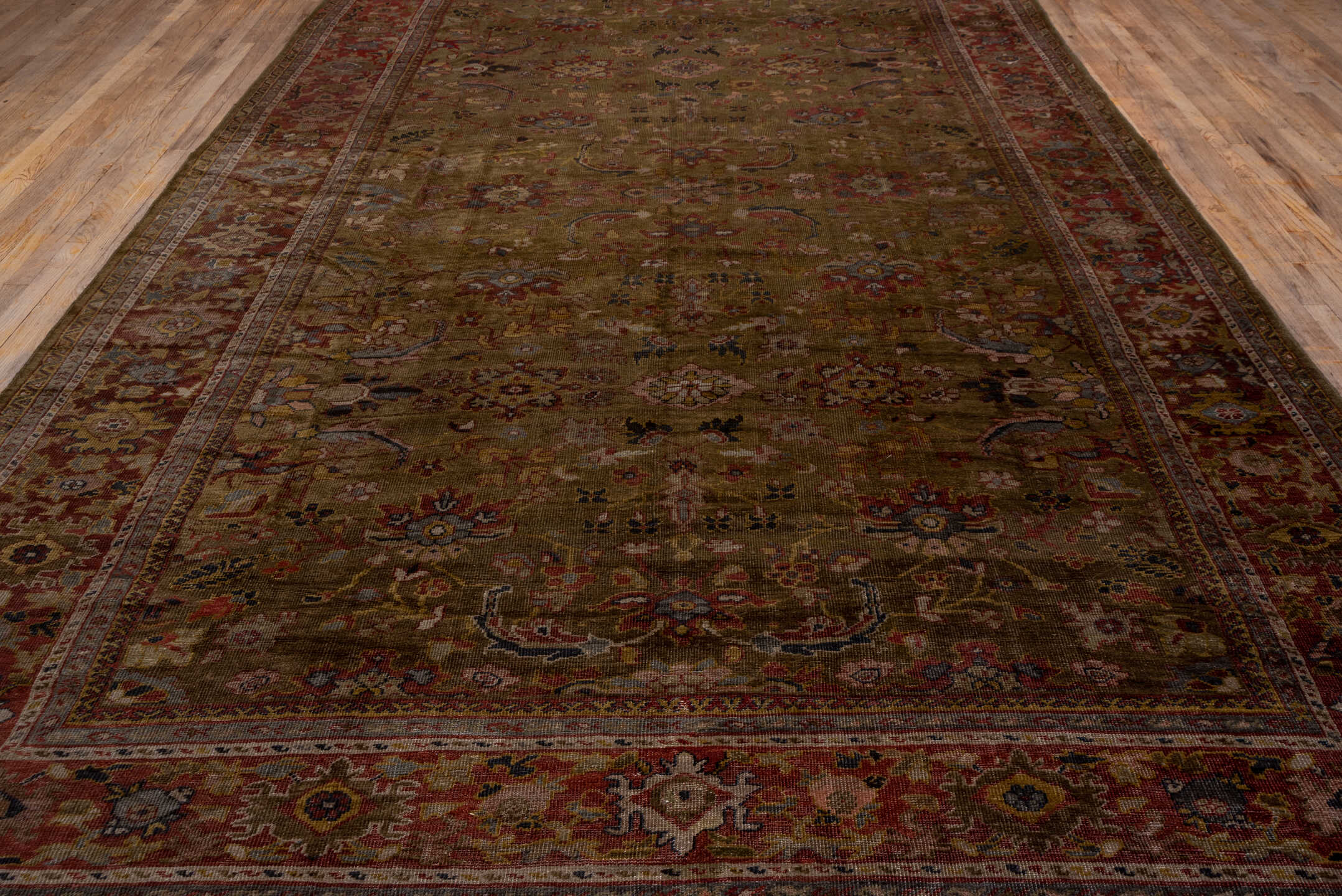 9' x 19' one-of-a-kind handmade antique Sultanabad rug. Color palette: camel, rust, taupe, ivory, burgundy, slate, rose