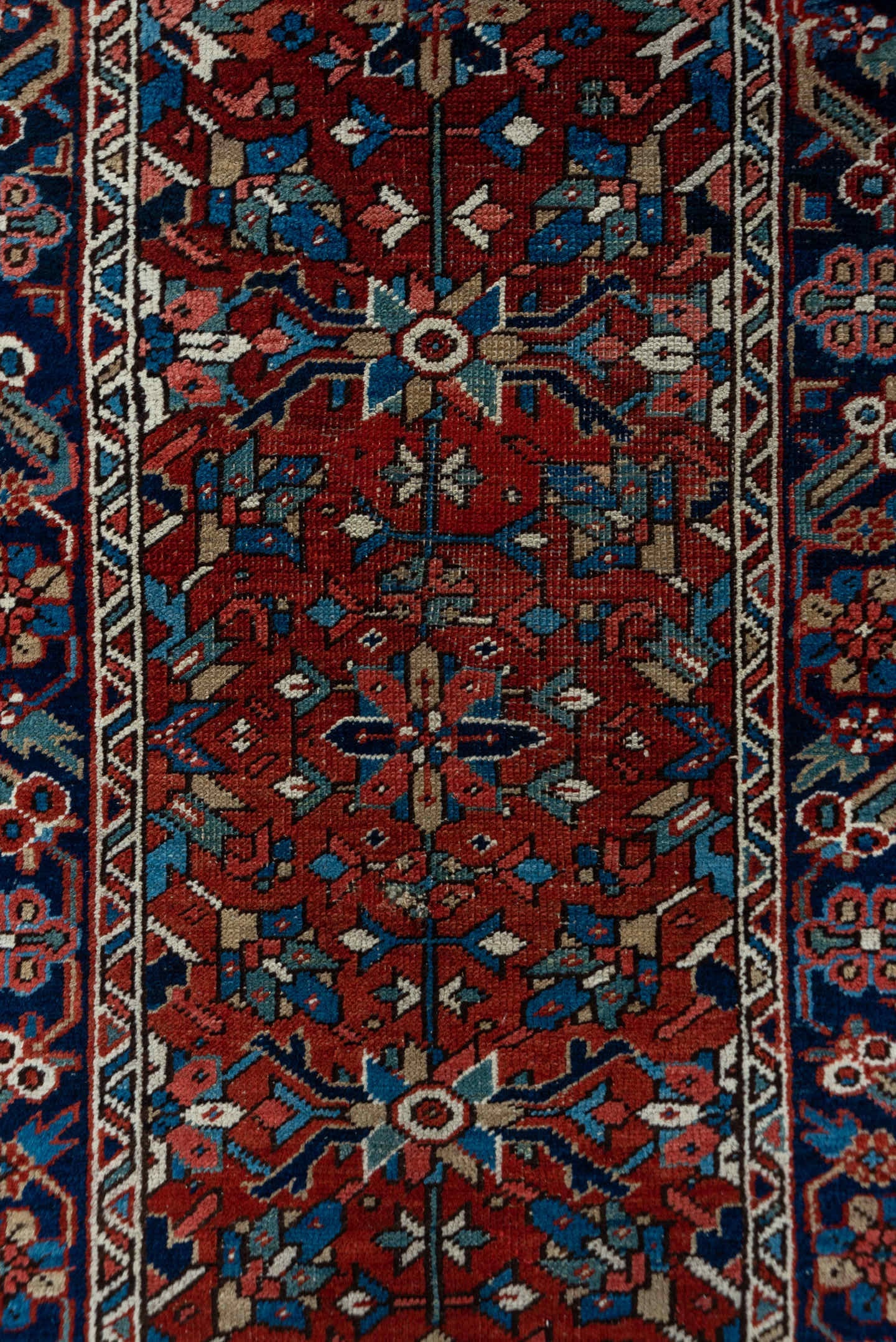 3' x 12' one-of-a-kind handmade vintage Heriz runner rug. Color palette: rust, navy, ivory, sky blue, rose, camel
