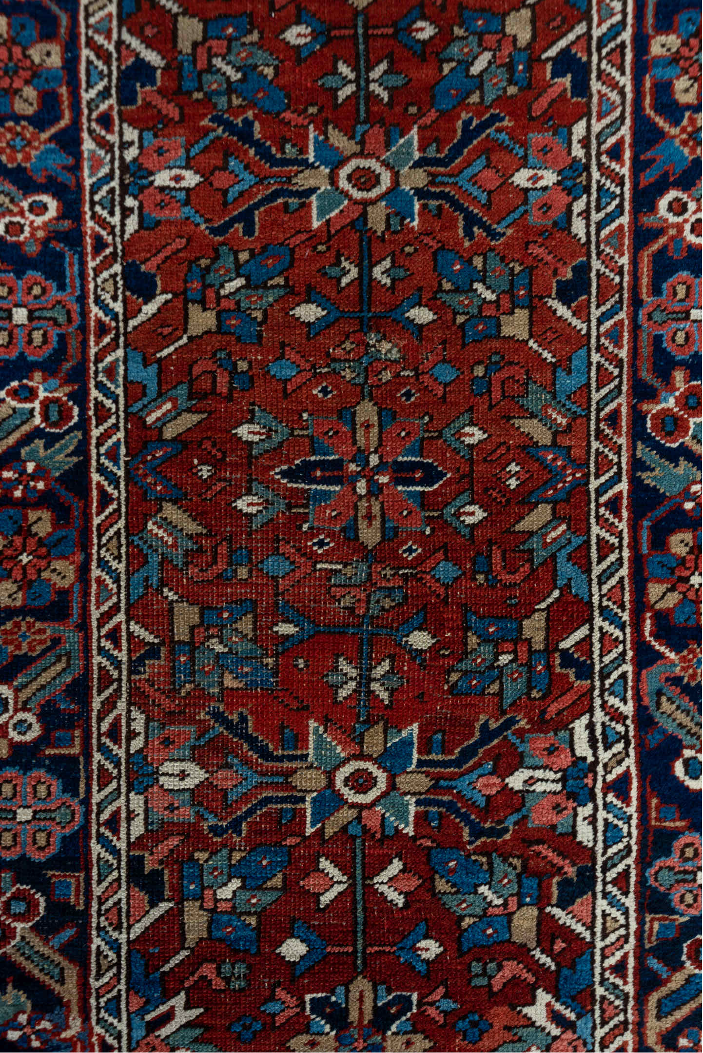 3' x 12' one-of-a-kind handmade vintage Heriz runner rug. Color palette: rust, navy, ivory, sky blue, rose, camel