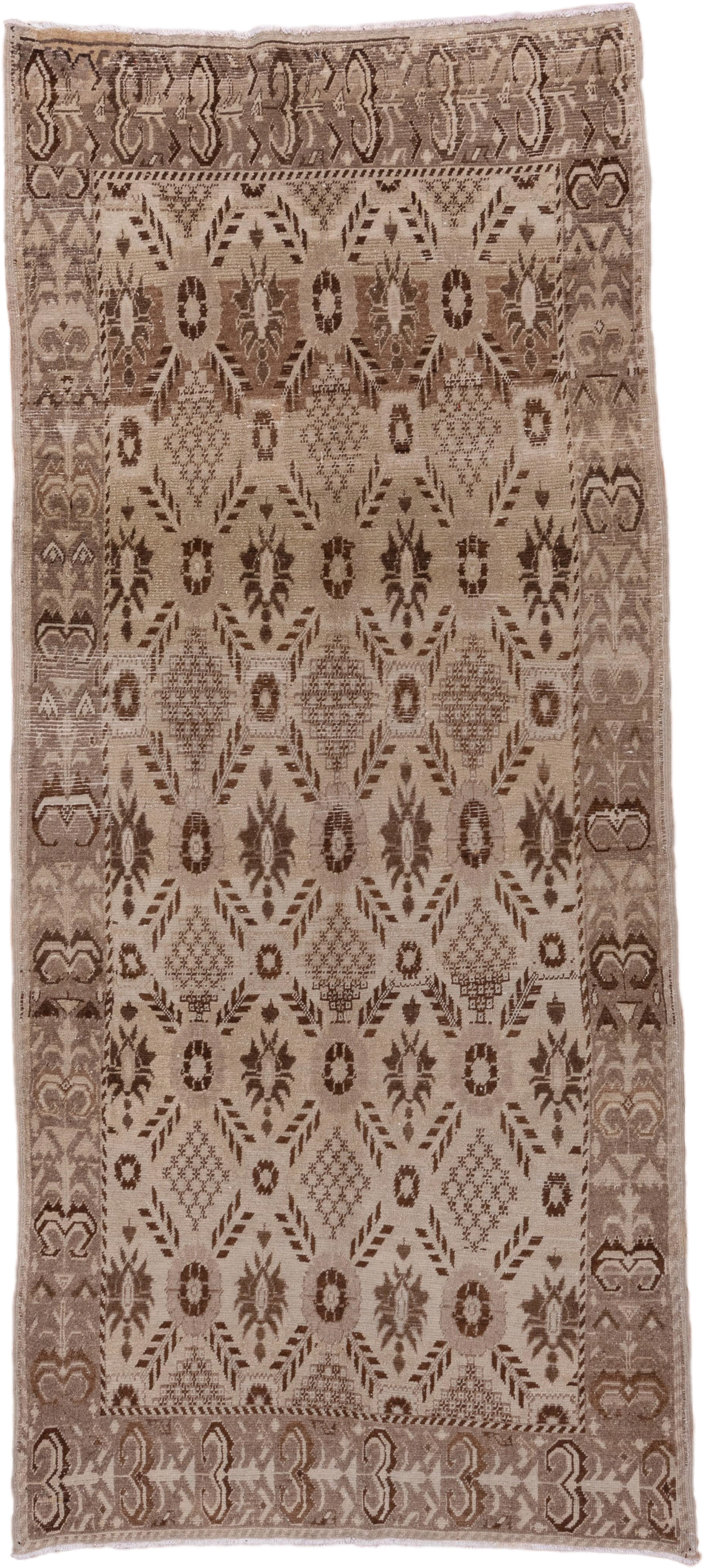 4' x 9' one-of-a-kind handmade vintage Oushak runner rug. Color palette: ivory, taupe, brown, beige, gray