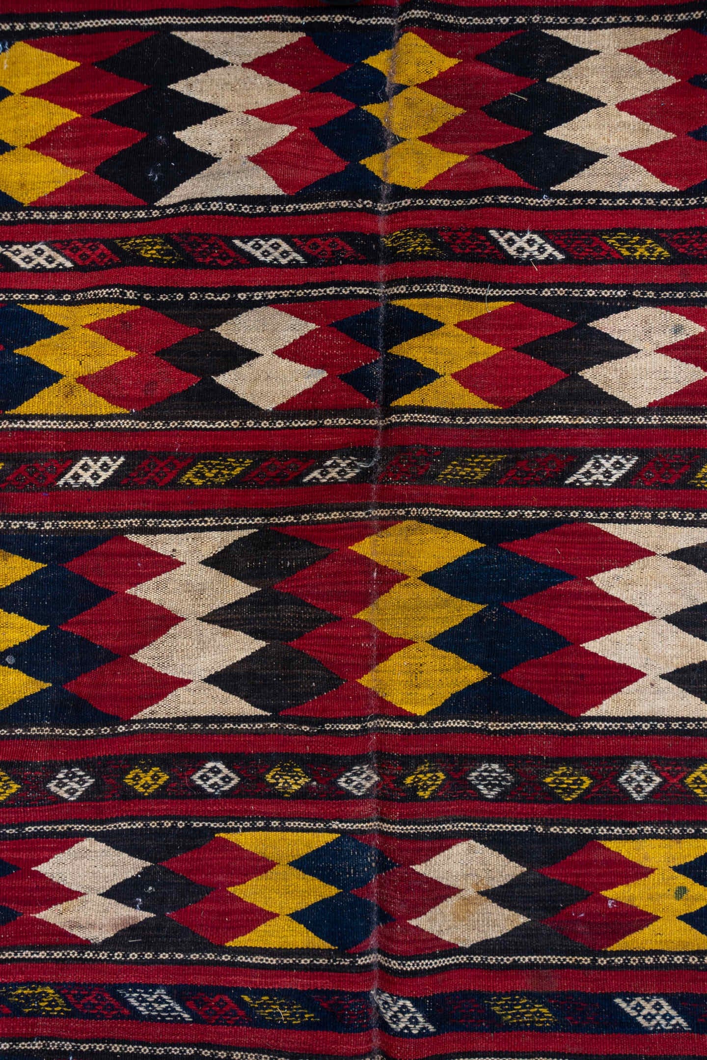 5' x 10' one-of-a-kind handmade vintage Kilim medium size rug. Color palette: crimson, ivory, gold, navy, charcoal, burgundy