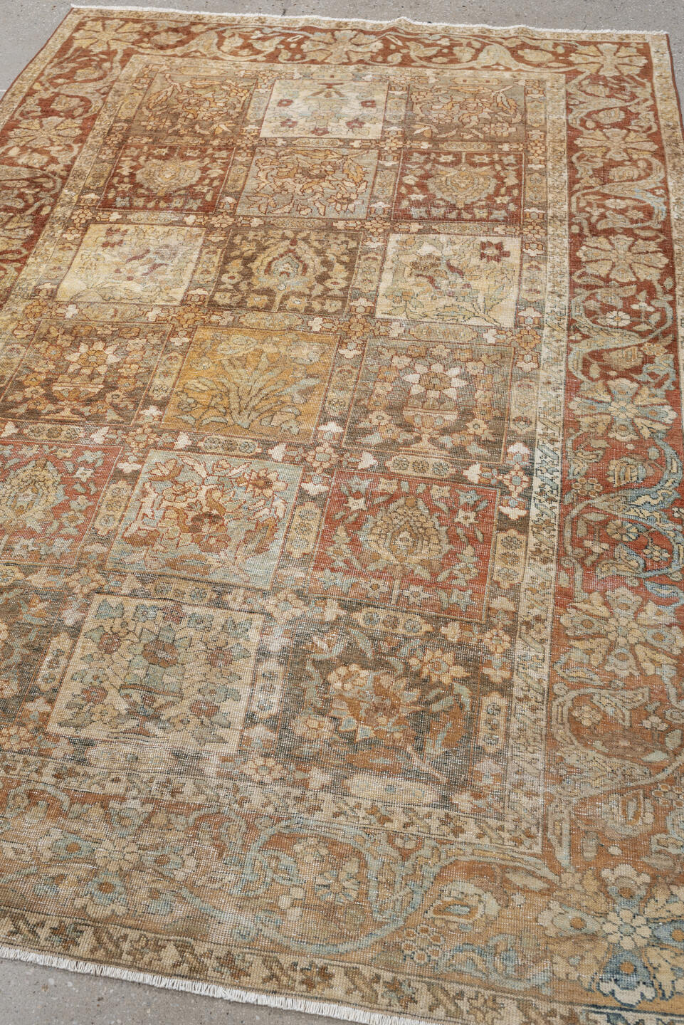 4' x 6' one-of-a-kind handmade antique Baktiary small size rug. Color palette: terracotta, ivory, pale blue, taupe, camel