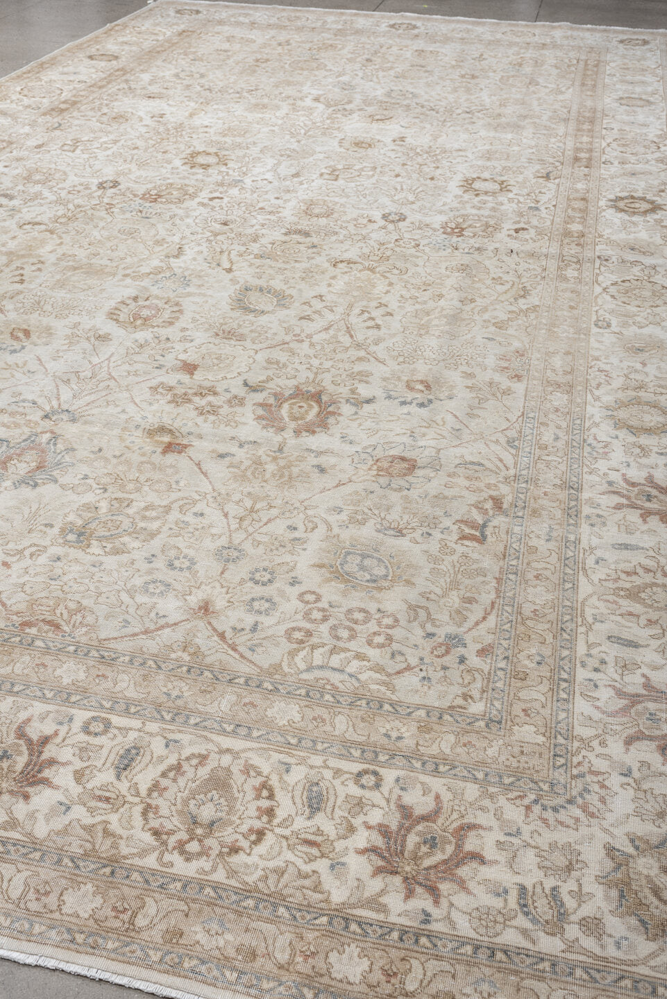 9' x 18' one-of-a-kind handmade antique Tabriz rug. Color palette: ivory, taupe, beige, camel, pale blue, sage, soft gold