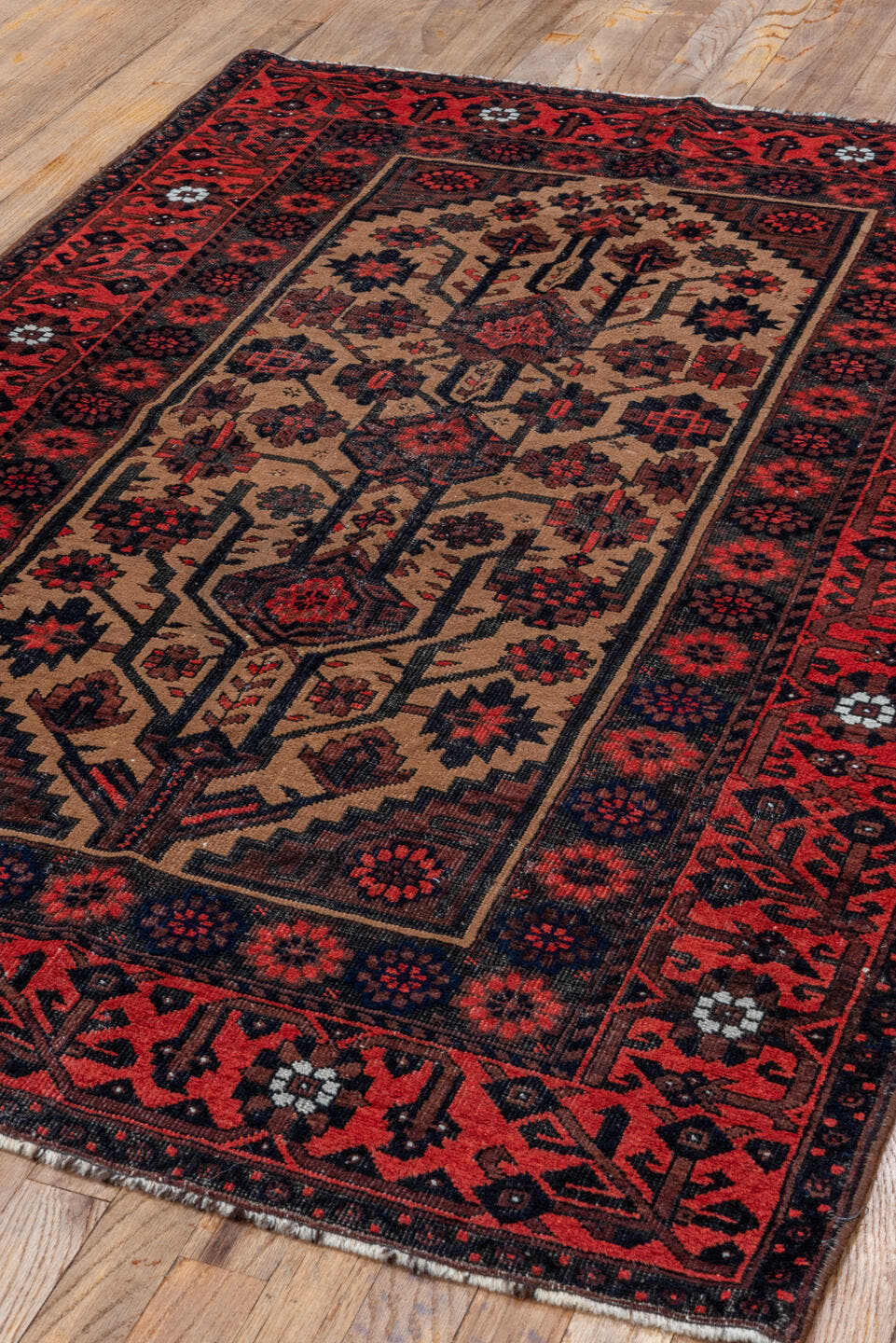 3' x 5' one-of-a-kind handmade antique Belouch small size rug. Color palette: crimson, ivory, navy, charcoal, rust, brown