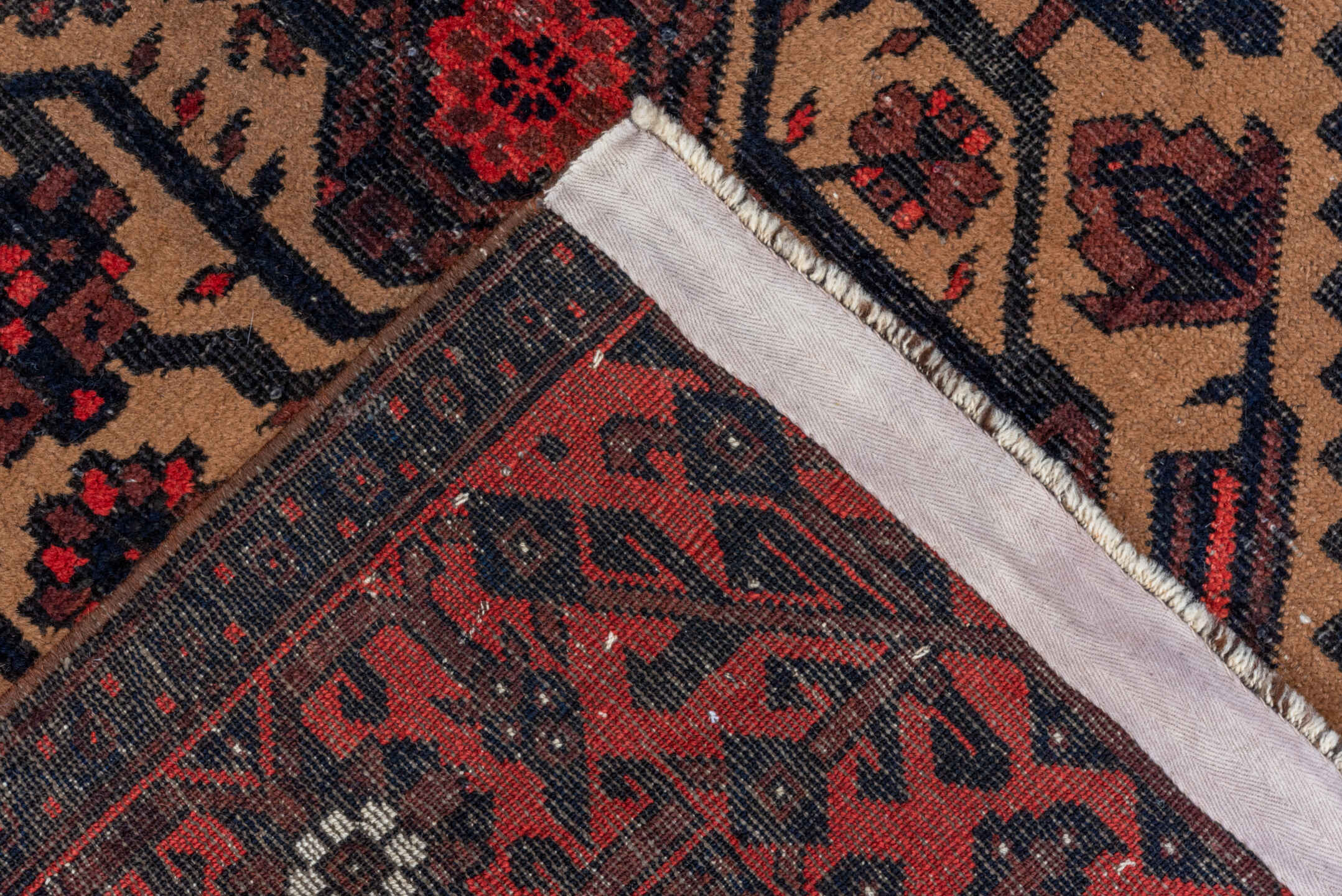 3' x 5' one-of-a-kind handmade antique Belouch small size rug. Color palette: crimson, ivory, navy, charcoal, rust, brown