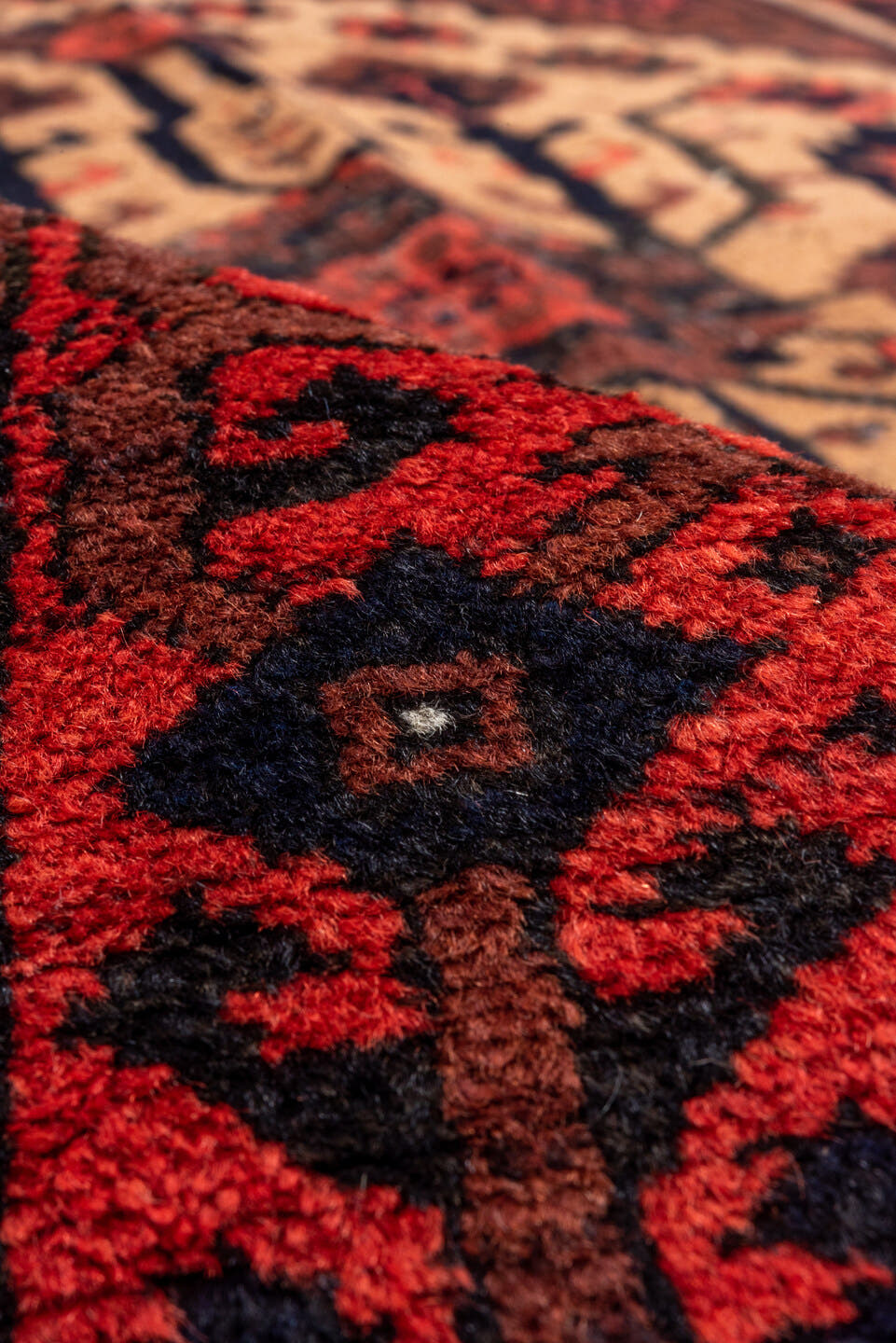 3' x 5' one-of-a-kind handmade antique Belouch small size rug. Color palette: crimson, ivory, navy, charcoal, rust, brown