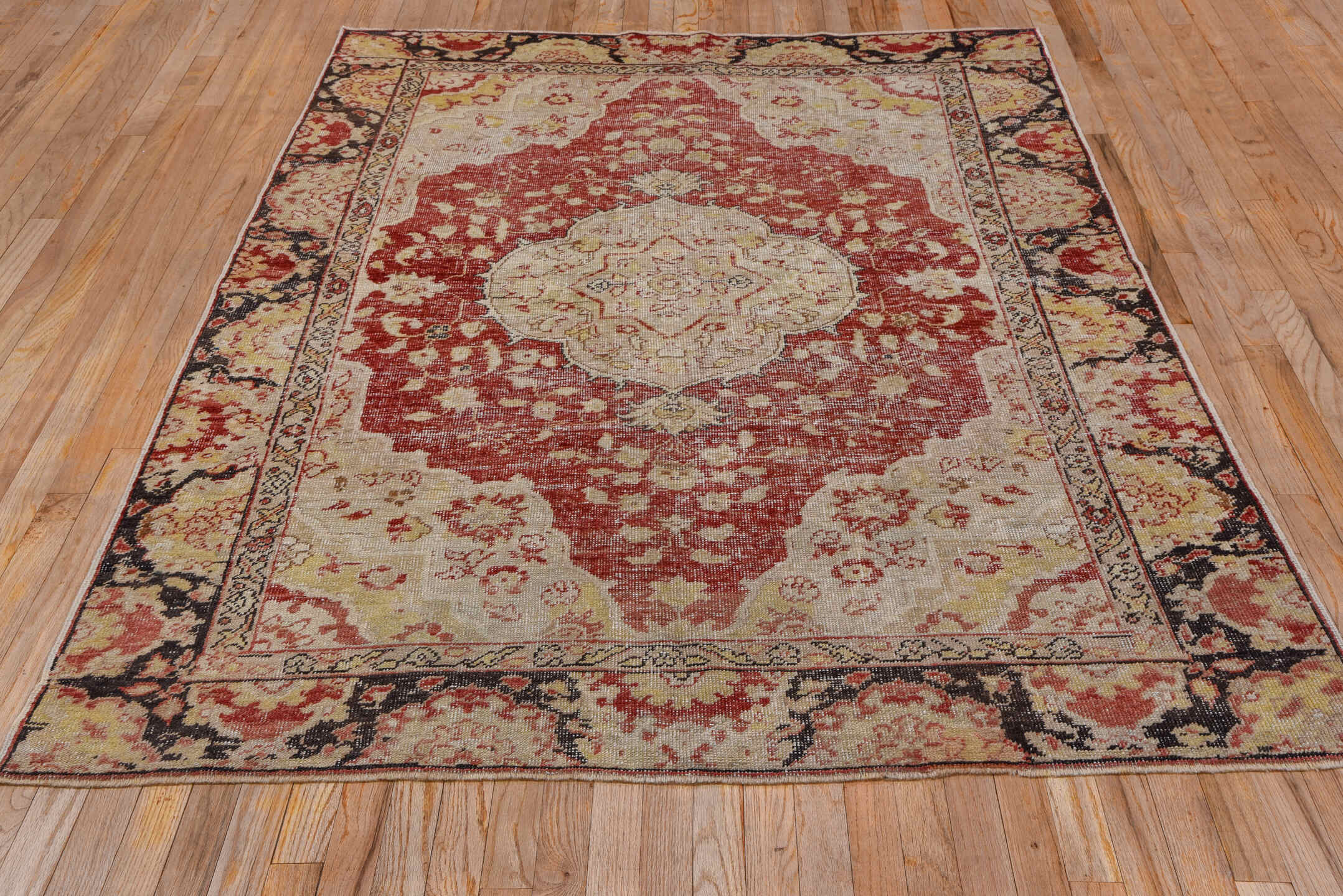 5' x 7' one-of-a-kind handmade vintage Oushak rug. Color palette: brown, gray, light gray, off-white, orange, pink, red