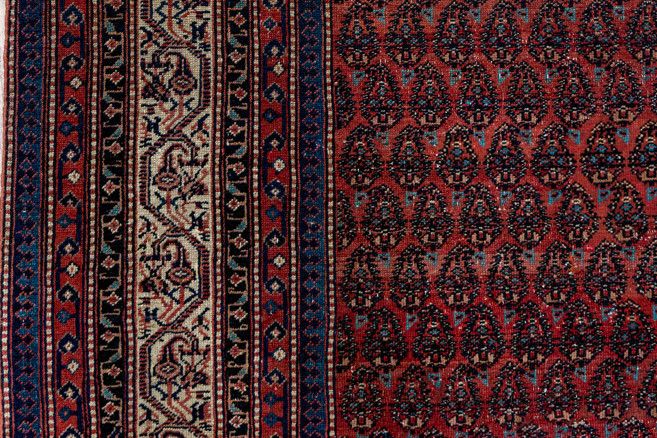 5' x 12' one-of-a-kind handmade antique Saraband rug. Color palette: rust, ivory, navy, burgundy, slate, rose, charcoal