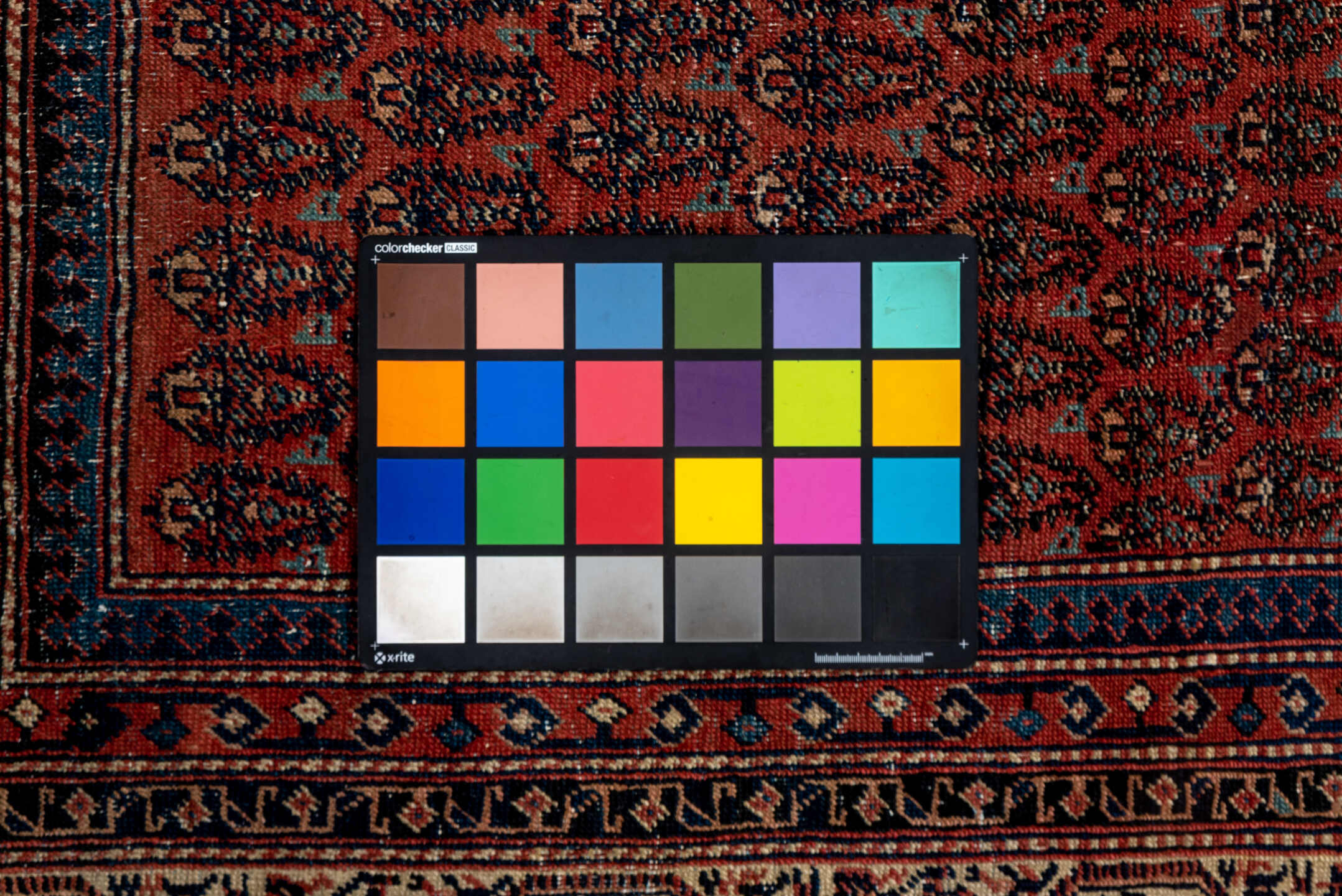 5' x 12' one-of-a-kind handmade antique Saraband rug. Color palette: rust, ivory, navy, burgundy, slate, rose, charcoal