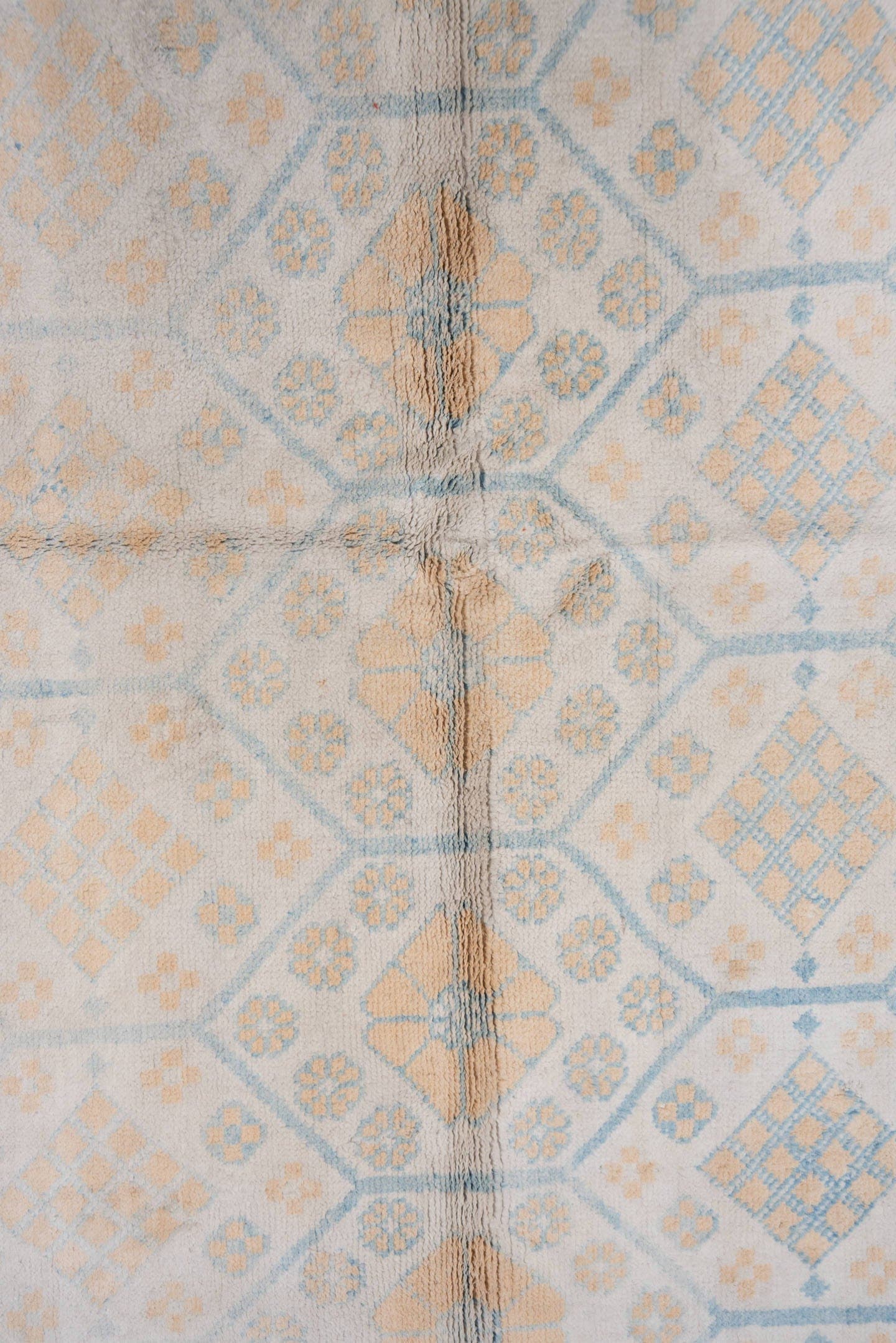 4' x 7' one-of-a-kind handmade vintage Cotton Agra rug. Color palette: ivory, pale blue, peach, sky blue, cream, taupe