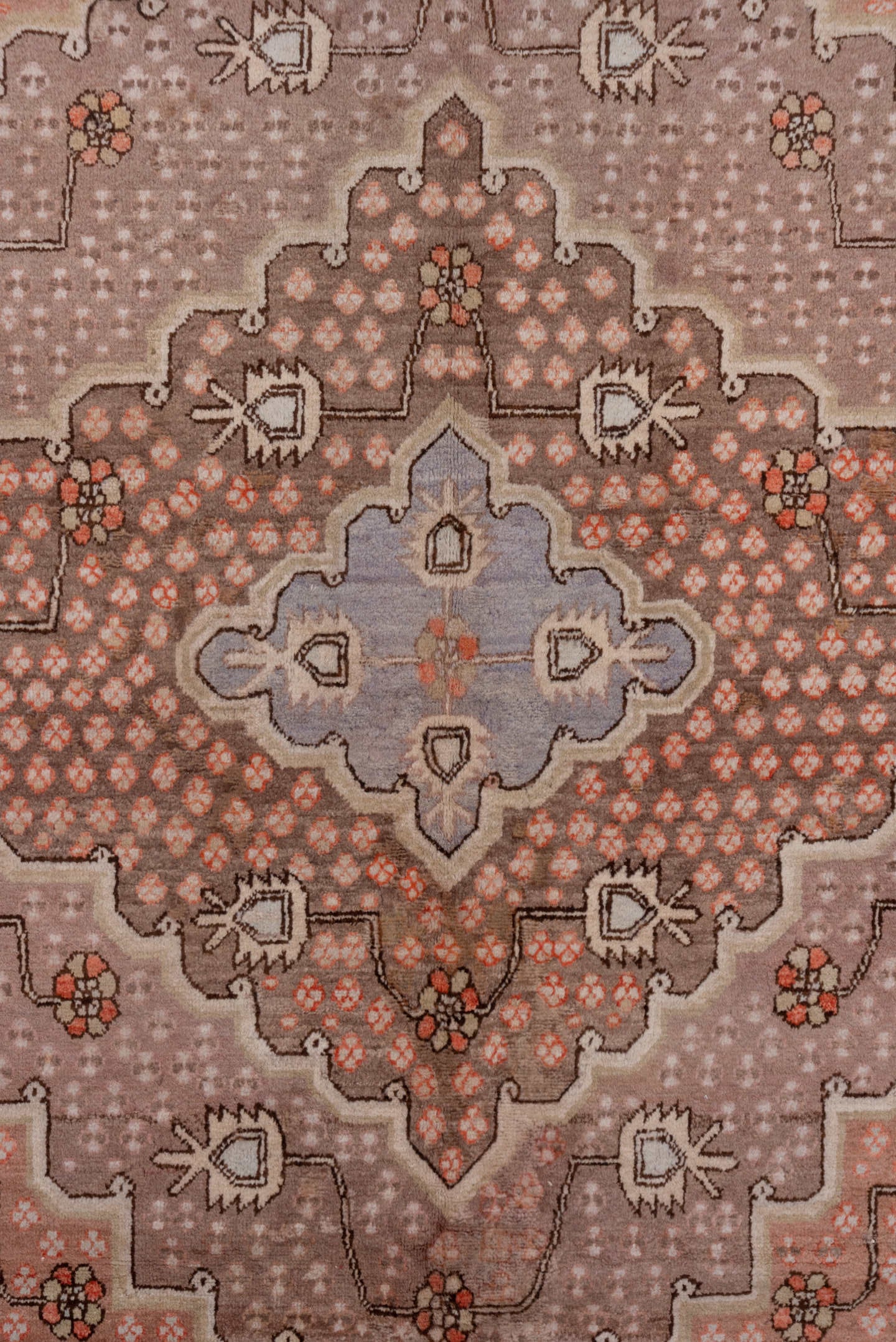 5' x 10' one-of-a-kind handmade vintage Khotan medium size rug. Color palette: rose, taupe, lavender, terra cotta, ivory