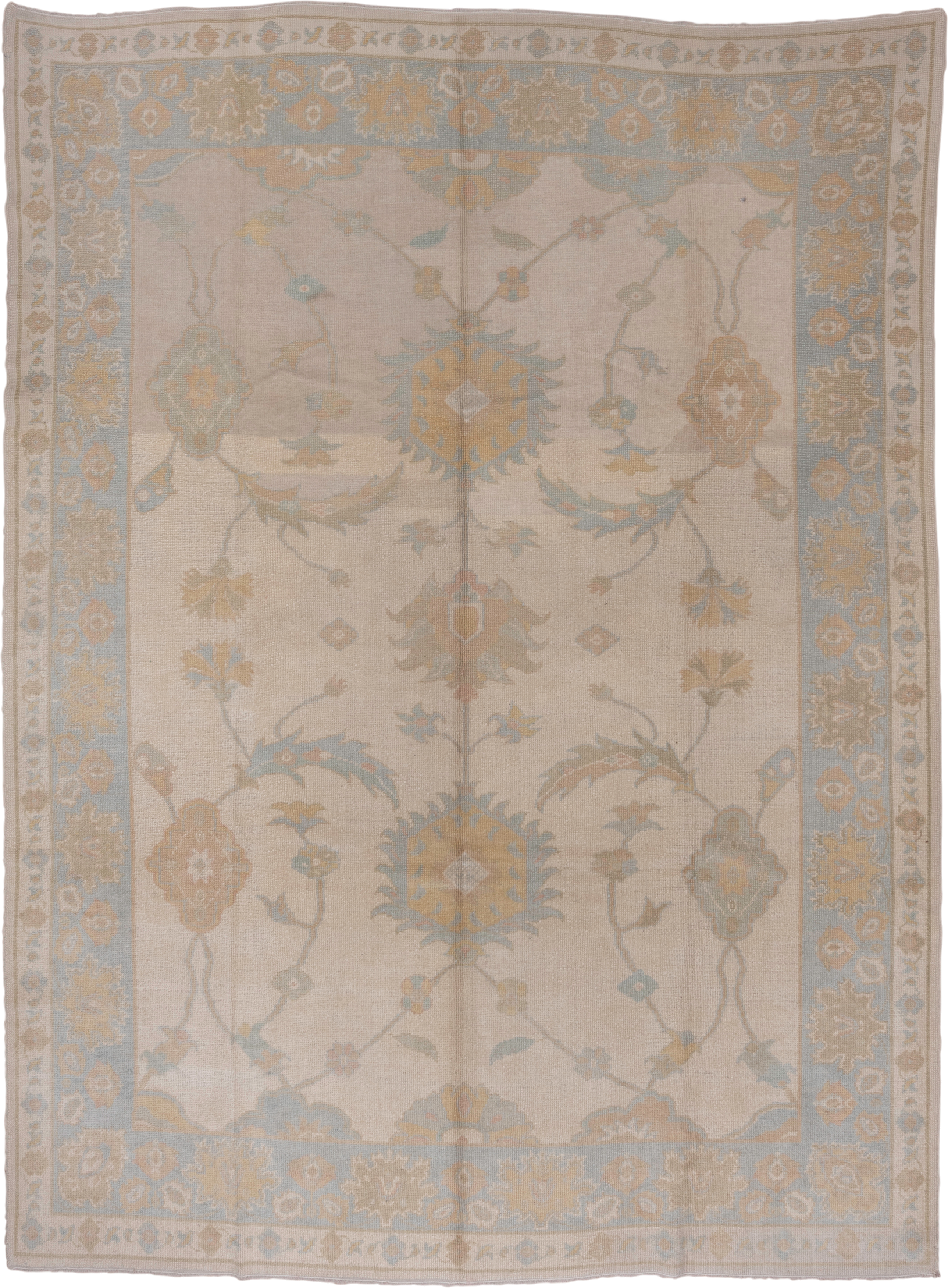 9' x 12' one-of-a-kind handmade vintage Oushak large size rug. Color palette: ivory, pale blue, taupe, gold, beige, sage