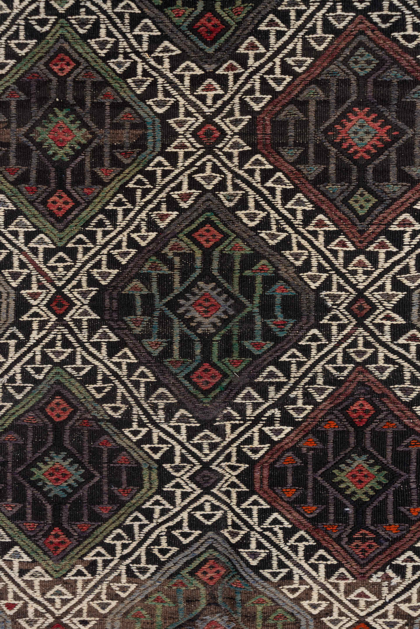 4' x 8' one-of-a-kind handmade vintage Jijim rug. Color palette: charcoal, ivory, rust, olive, taupe, rose, slate, gray