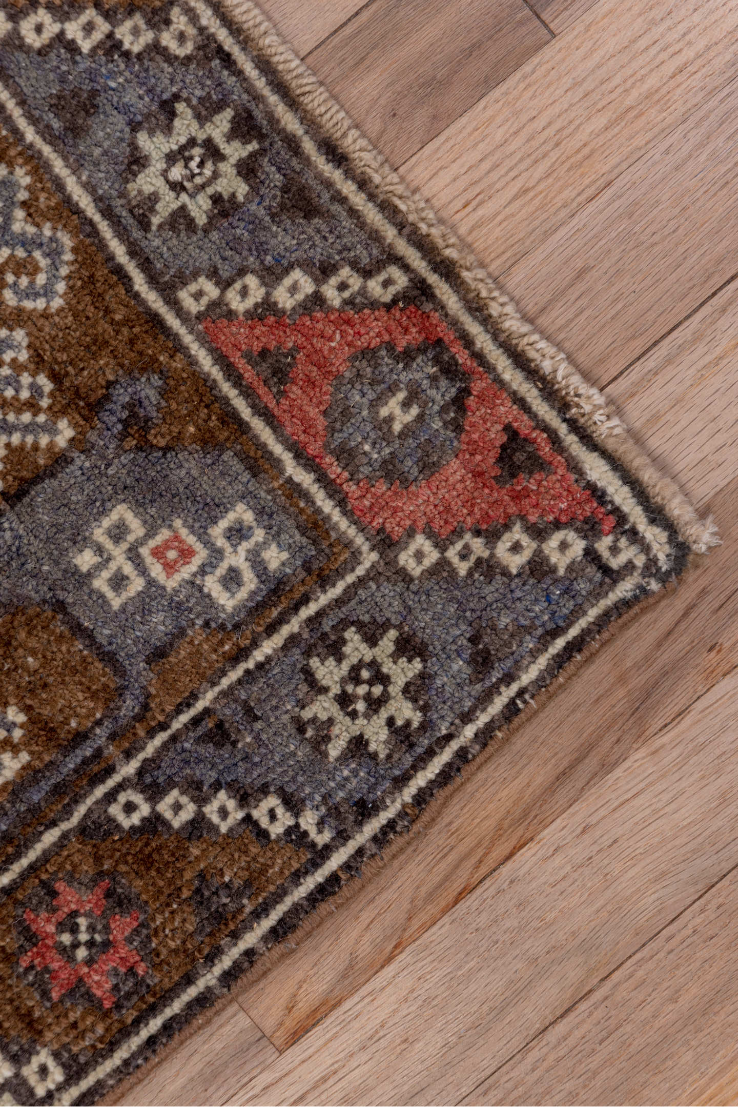 4' x 8' one-of-a-kind handmade antique Konya runner rug. Color palette: brown, coral, ivory, indigo, rust, taupe, slate