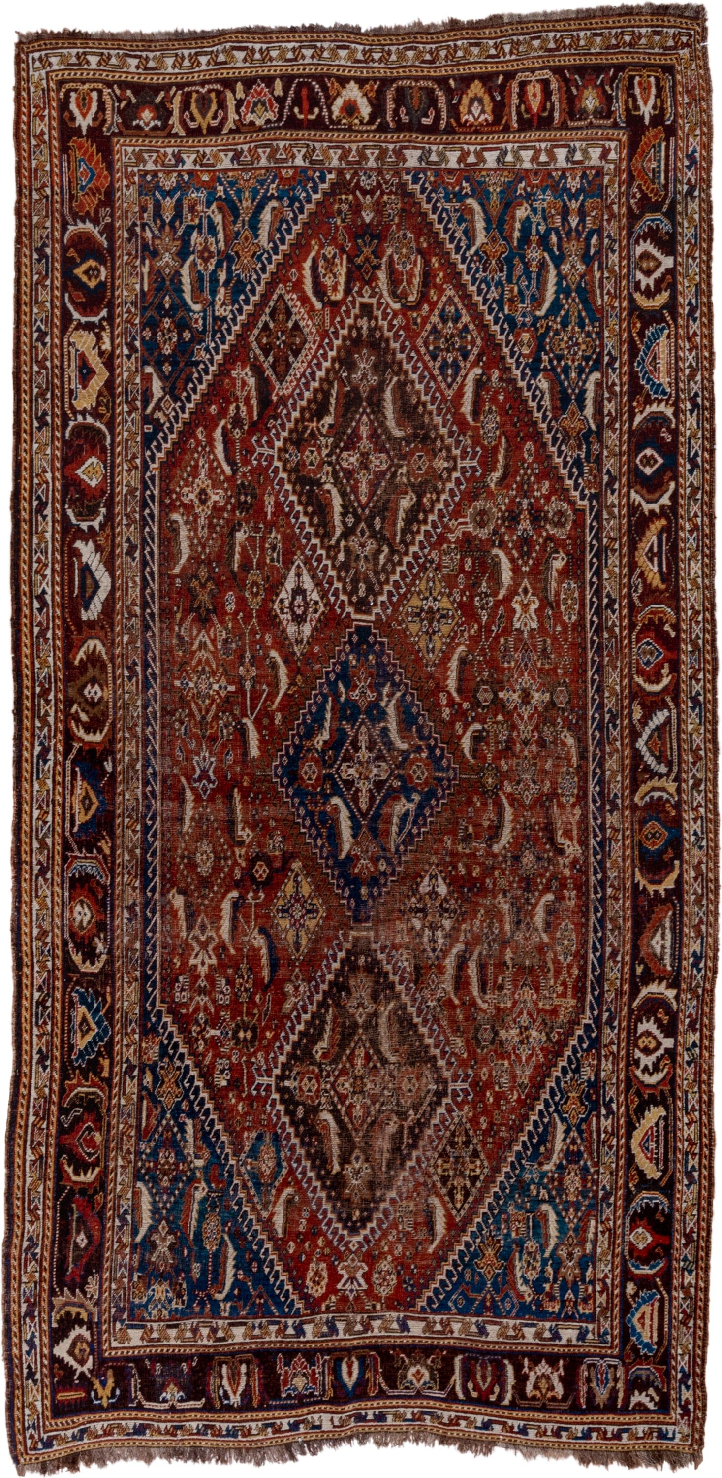 5' x 9' one-of-a-kind handmade antique Qashqai medium size rug. Color palette: rust, indigo, ivory, walnut, camel, navy
