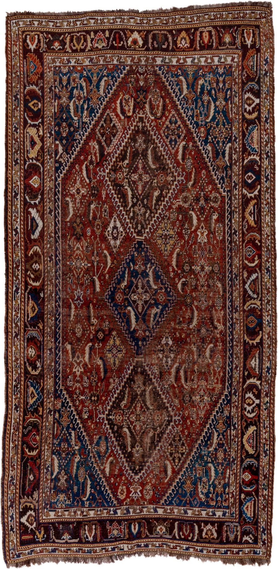 5' x 9' one-of-a-kind handmade antique Qashqai medium size rug. Color palette: rust, indigo, ivory, walnut, camel, navy