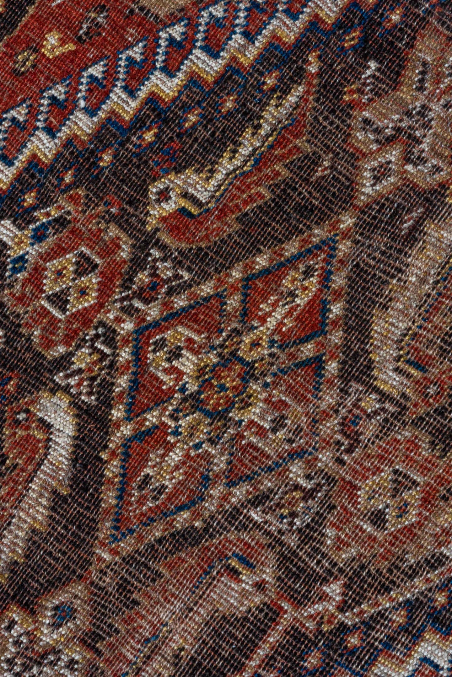 5' x 9' one-of-a-kind handmade antique Qashqai medium size rug. Color palette: rust, indigo, ivory, walnut, camel, navy