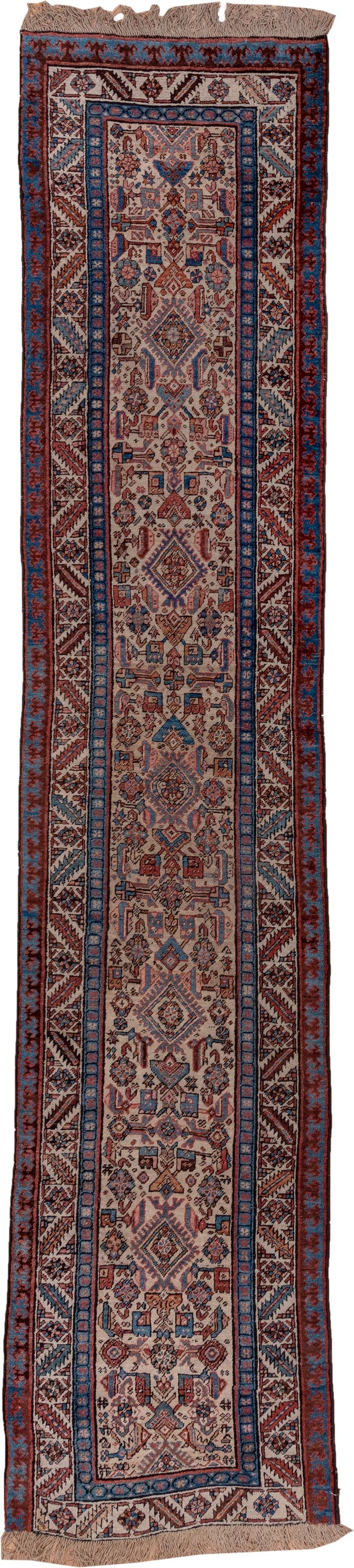 3' x 13' one-of-a-kind handmade antique Sarab runner rug. Color palette: ivory, rust, indigo, burgundy, camel, slate