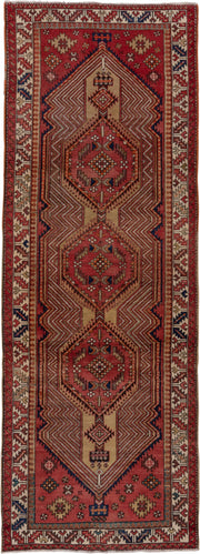 4' x 11' one-of-a-kind handmade antique Sarab runner rug. Color palette: rust, ivory, brick, navy, camel, burgundy