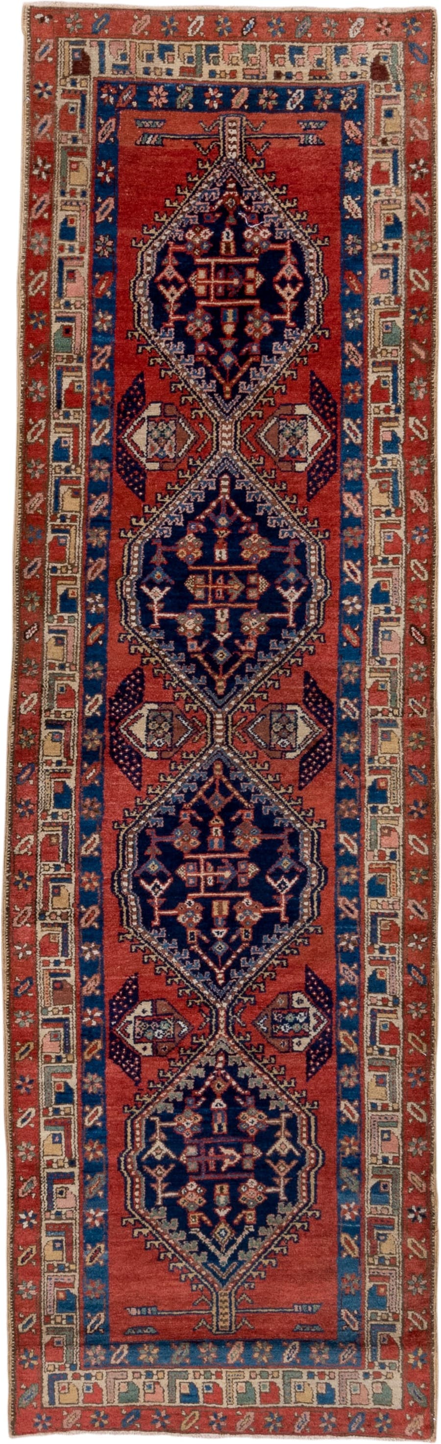 3' x 9' one-of-a-kind handmade vintage Heriz runner rug. Color palette: rust, navy, ivory, cobalt, camel, rose, terracotta