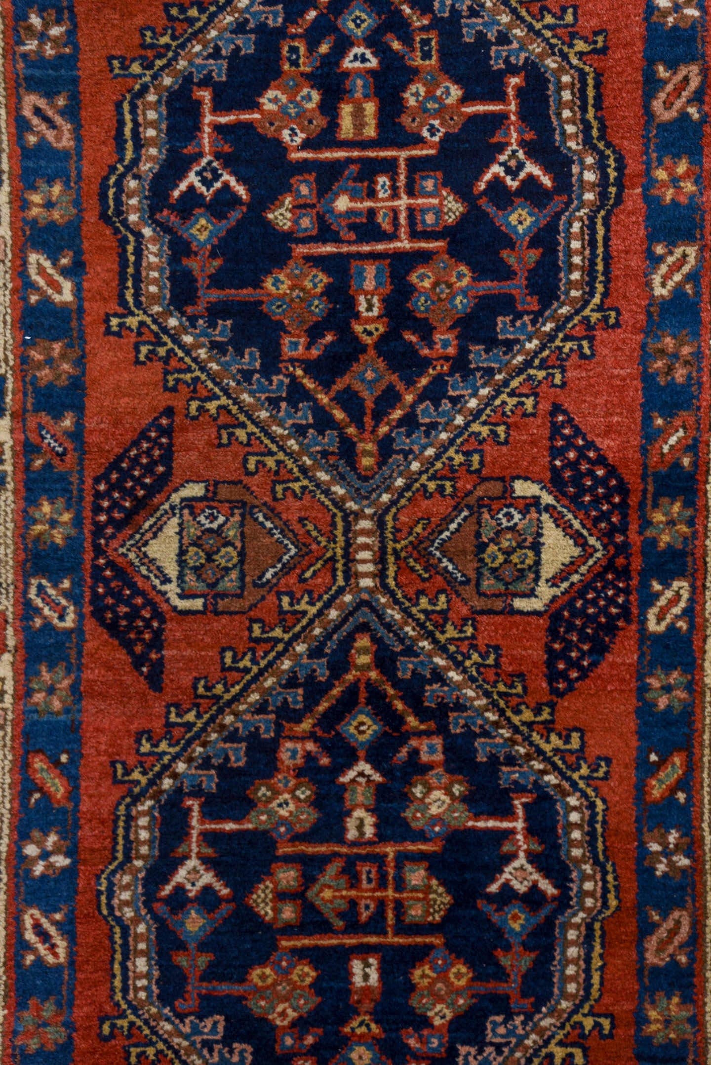 3' x 9' one-of-a-kind handmade vintage Heriz runner rug. Color palette: rust, navy, ivory, cobalt, camel, rose, terracotta