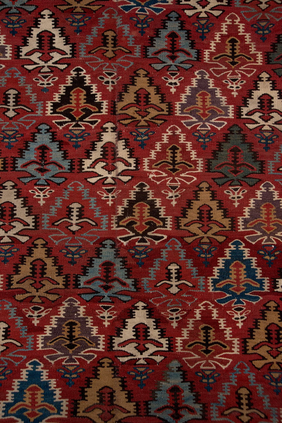 5' x 13' one-of-a-kind handmade antique Kilim rug. Color palette: rust, ivory, indigo, camel, charcoal, sky blue, burgundy