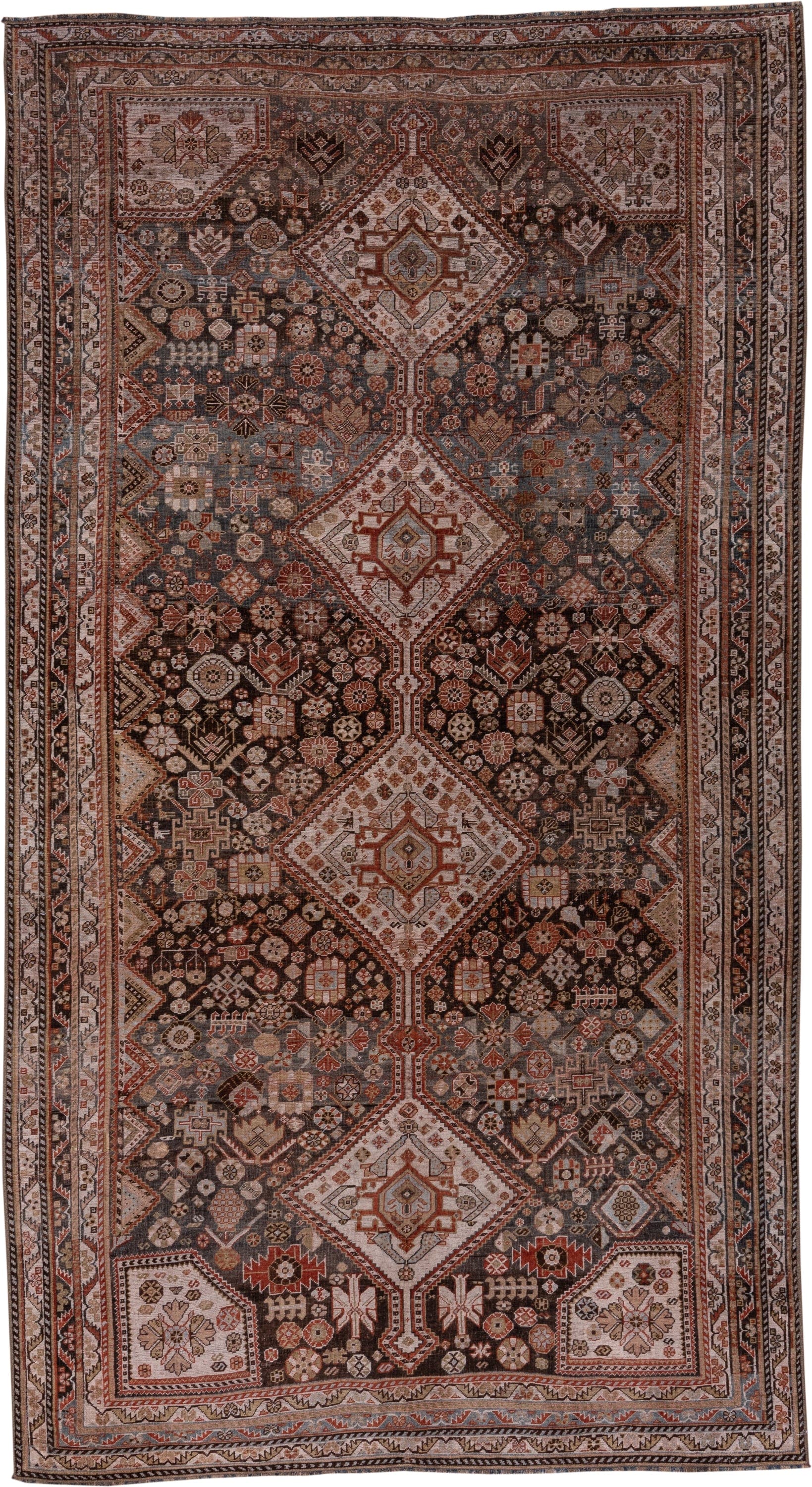5' x 10' one-of-a-kind handmade antique Qashqai medium size rug. Color palette: ivory, charcoal, rust, slate, taupe, camel