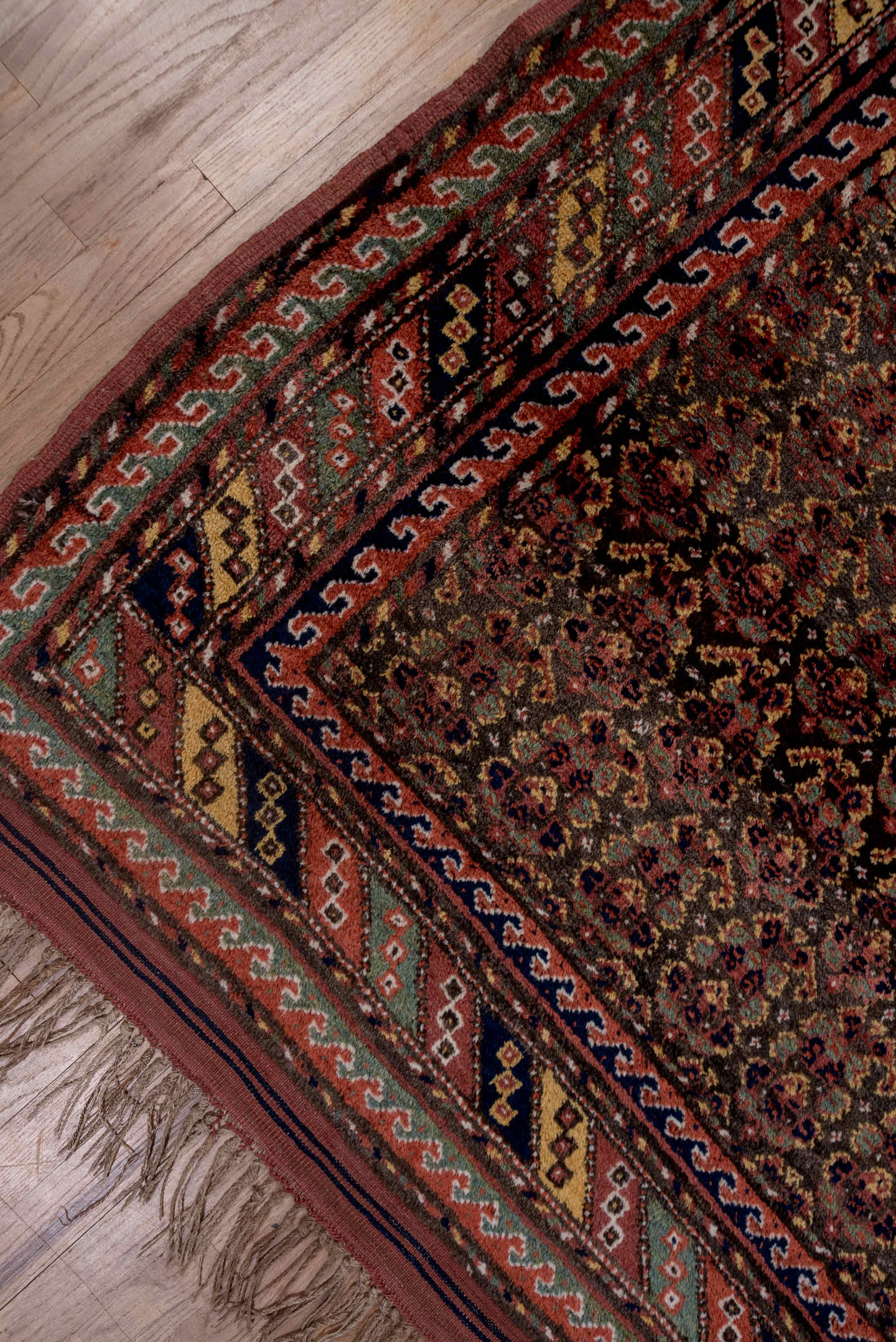 4' x 9' one-of-a-kind handmade antique Kurd rug. Color palette: rust, navy, brown, rose, ivory, gold, sage, terracotta, blue