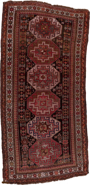 4' x 9' one-of-a-kind handmade antique Kazak runner rug. Color palette: rust, ivory, burgundy, charcoal, rose, taupe