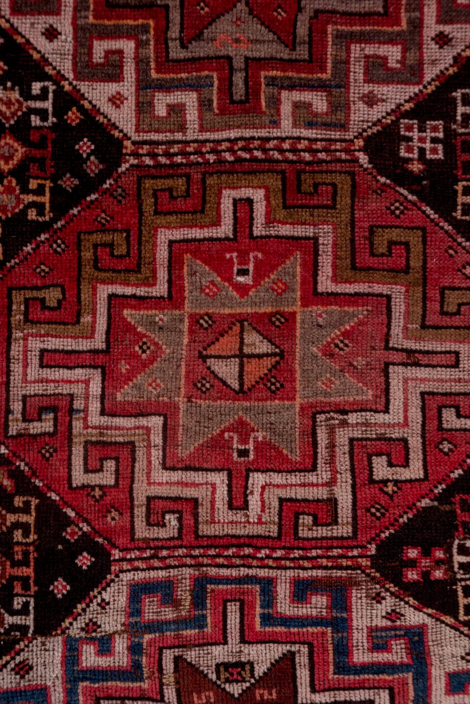 4' x 9' one-of-a-kind handmade antique Kazak runner rug. Color palette: rust, ivory, burgundy, charcoal, rose, taupe