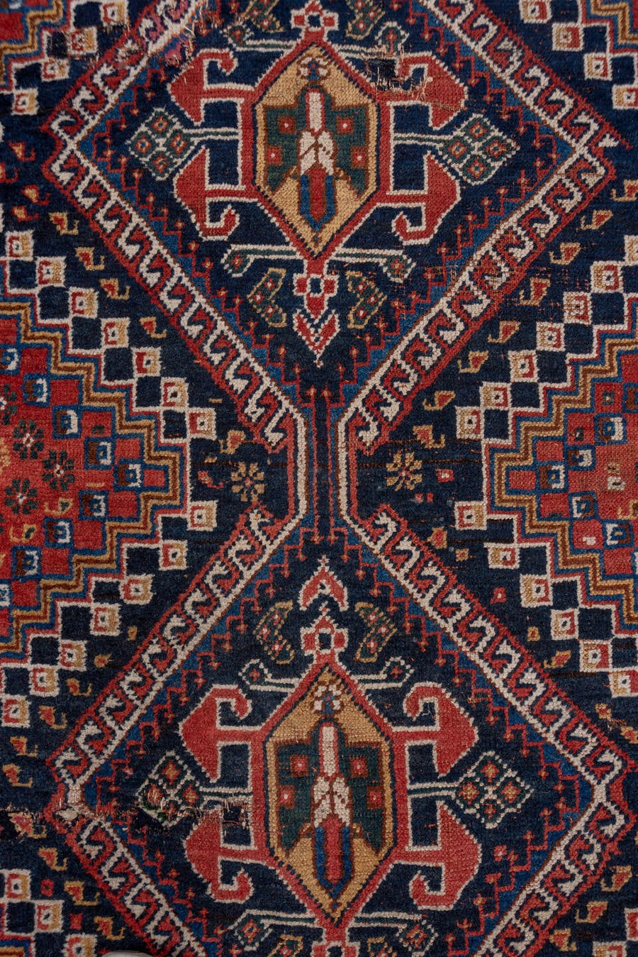 3' x 9' one-of-a-kind handmade antique Shiraz runner rug. Color palette: rust, navy, ivory, indigo, camel, gold, crimson