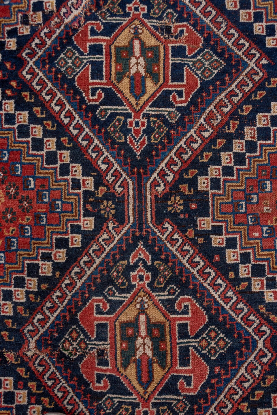 3' x 9' one-of-a-kind handmade antique Shiraz runner rug. Color palette: rust, navy, ivory, indigo, camel, gold, crimson