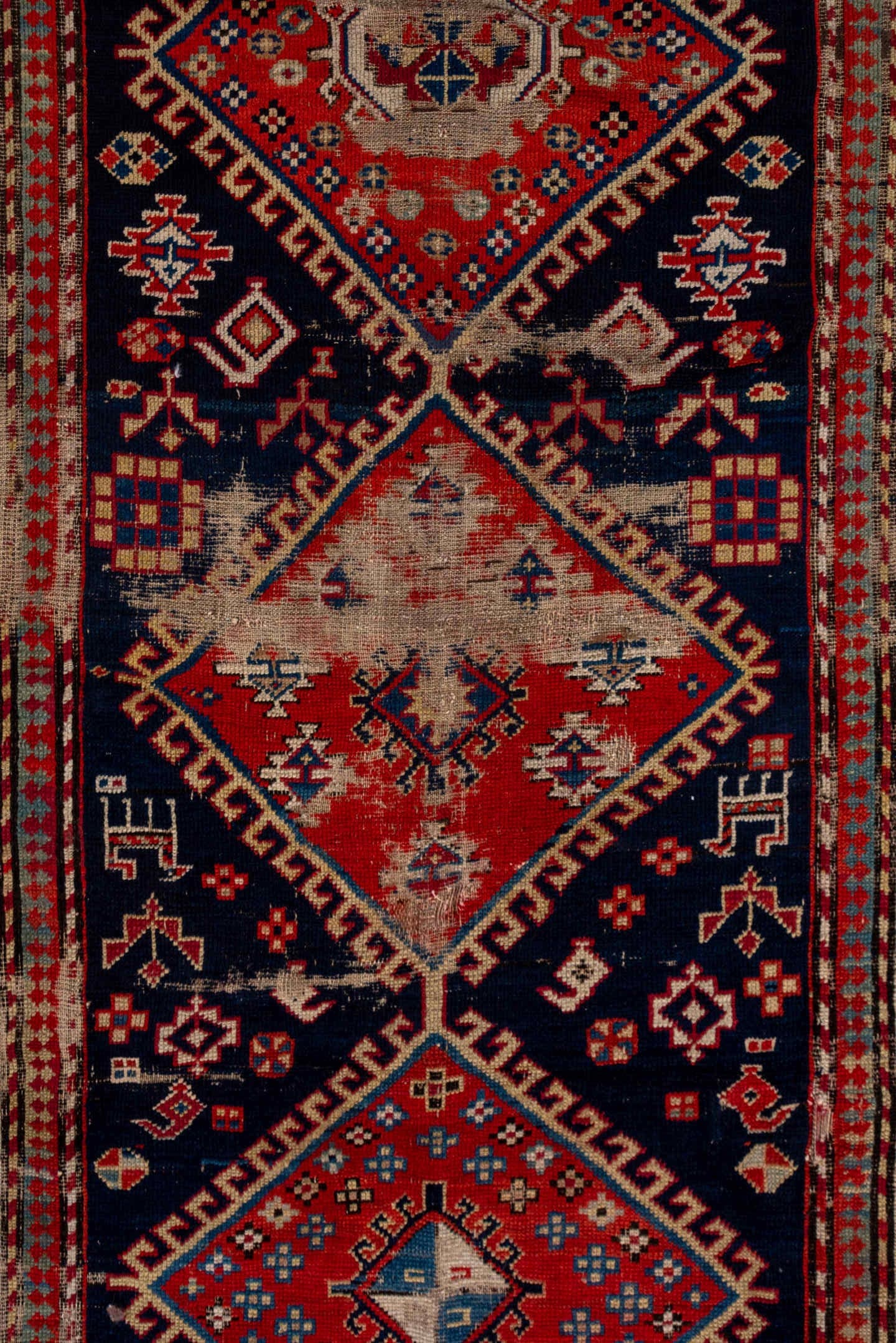 4' x 9' one-of-a-kind handmade vintage Shirvan runner rug. Color palette: navy, rust, ivory, sky blue, camel, red, slate