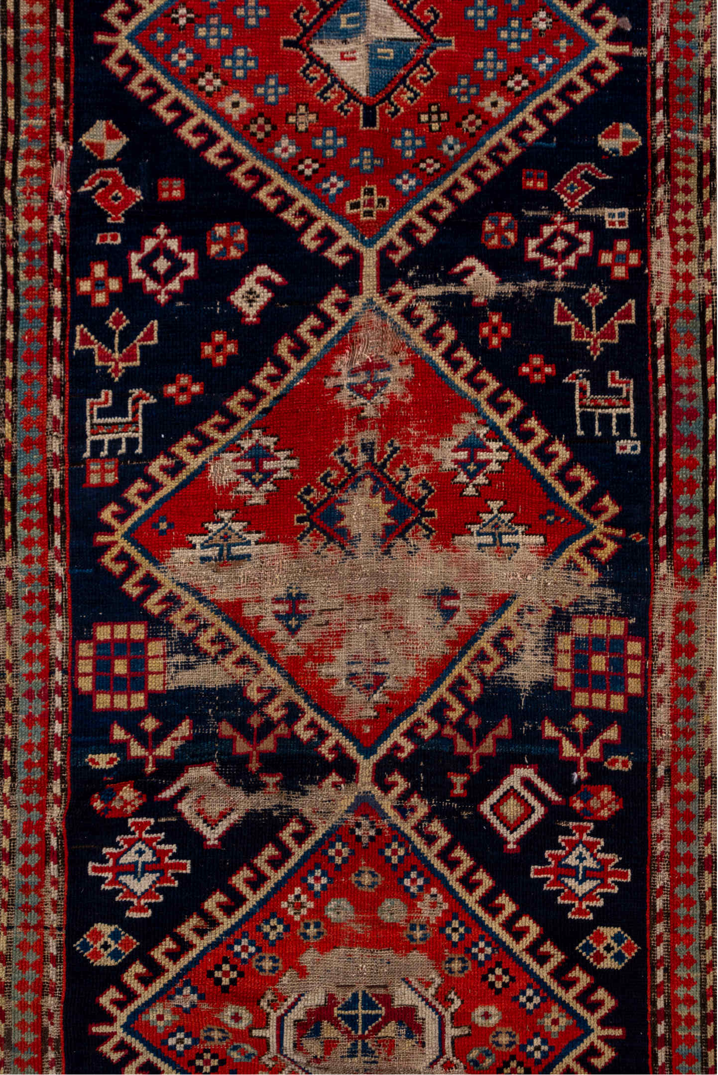 4' x 9' one-of-a-kind handmade vintage Shirvan runner rug. Color palette: blue, brown, gray, pink, red, redwood