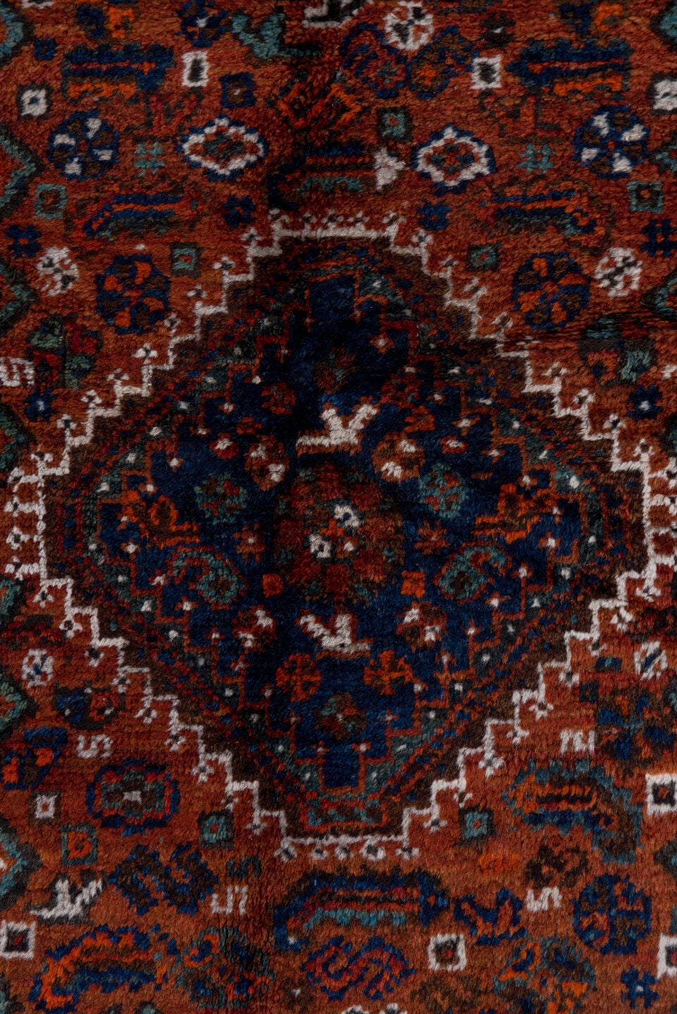 2' x 4' one-of-a-kind handmade antique Shiraz small size rug. Color palette: rust, indigo, ivory, terra cotta, teal