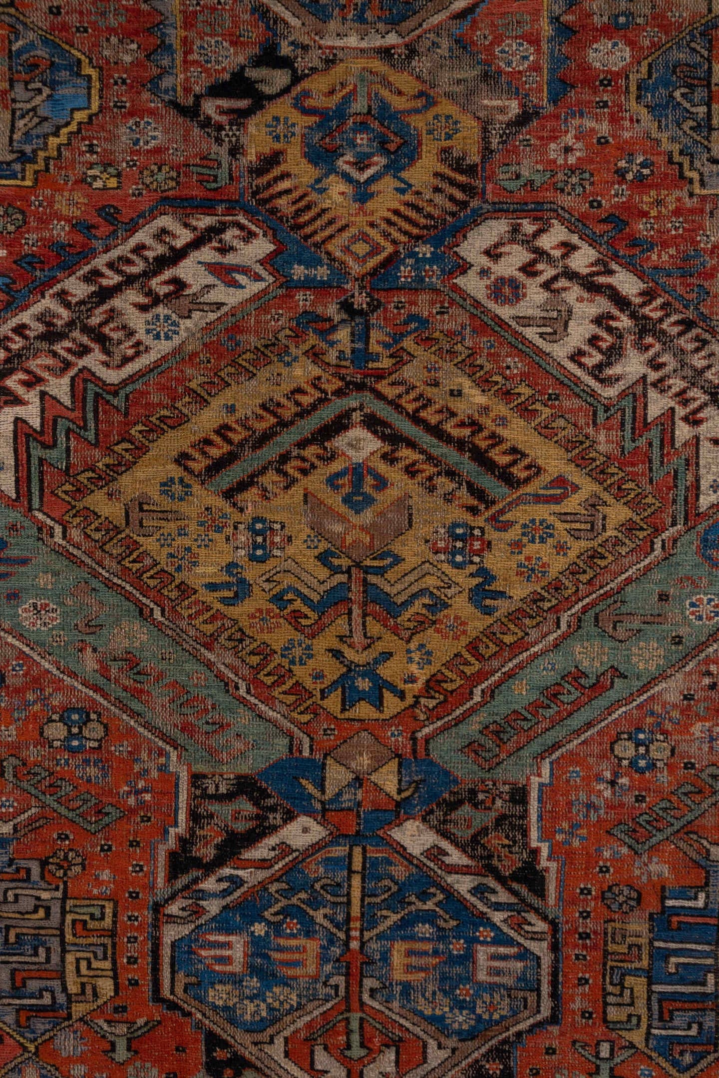6' x 10' one-of-a-kind handmade antique Sumak large size rug. Color palette: rust, indigo, ivory, camel, aqua, charcoal