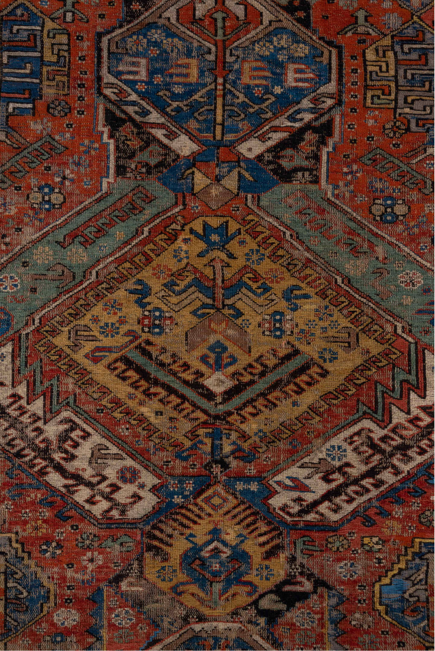 6' x 10' one-of-a-kind handmade antique Sumak large size rug. Color palette: rust, indigo, ivory, camel, aqua, charcoal