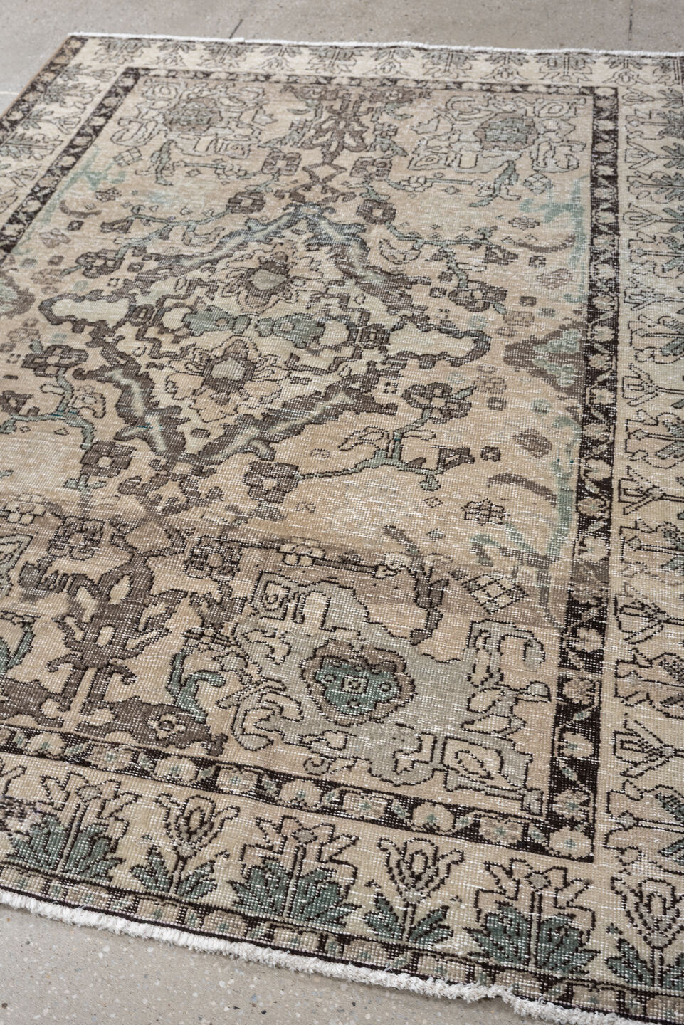 5' x 6' one-of-a-kind handmade vintage Baktiary rug. Color palette: ivory, charcoal, taupe, pale aqua, sage, beige, black