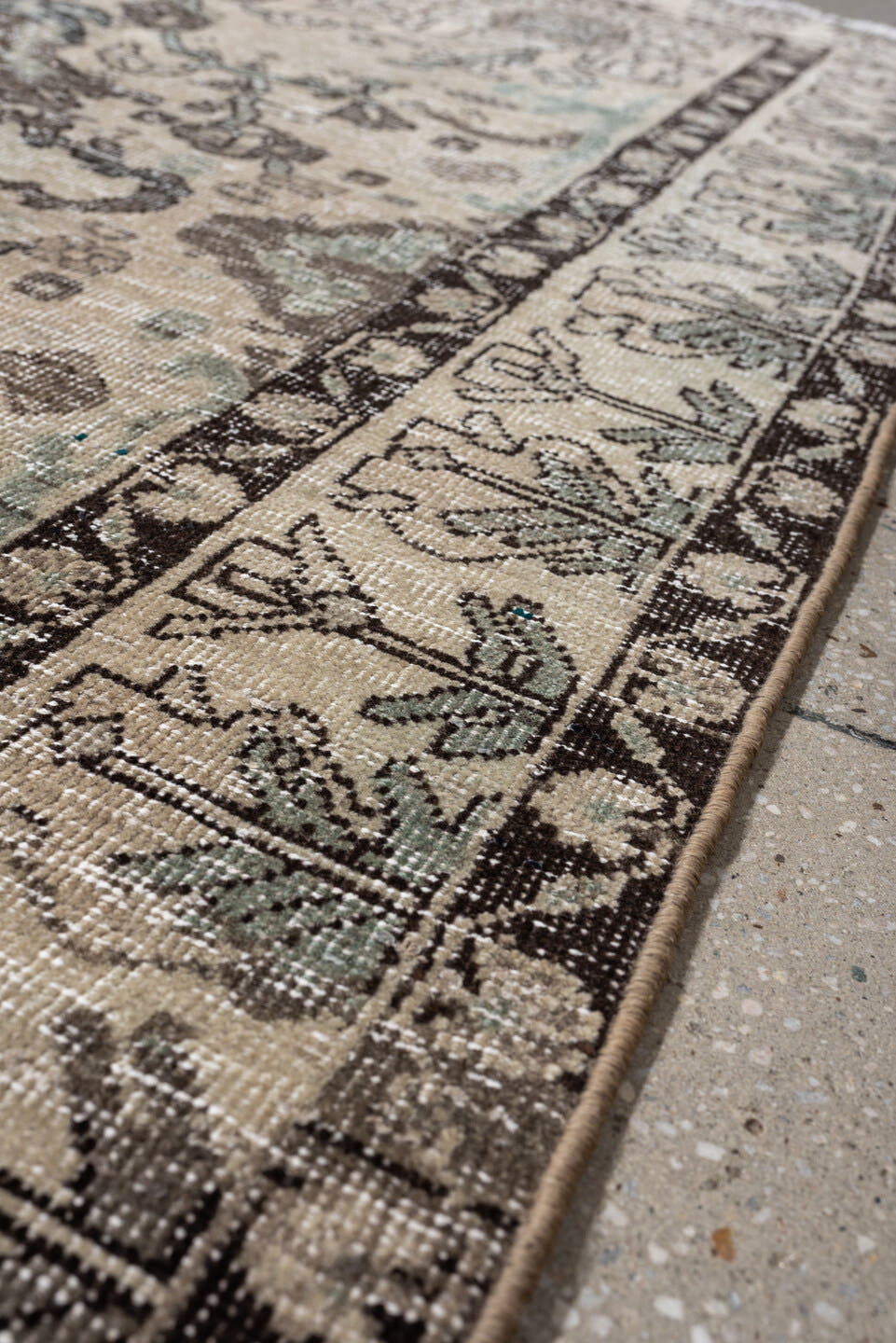 5' x 6' one-of-a-kind handmade vintage Baktiary rug. Color palette: ivory, charcoal, taupe, pale aqua, sage, beige, black