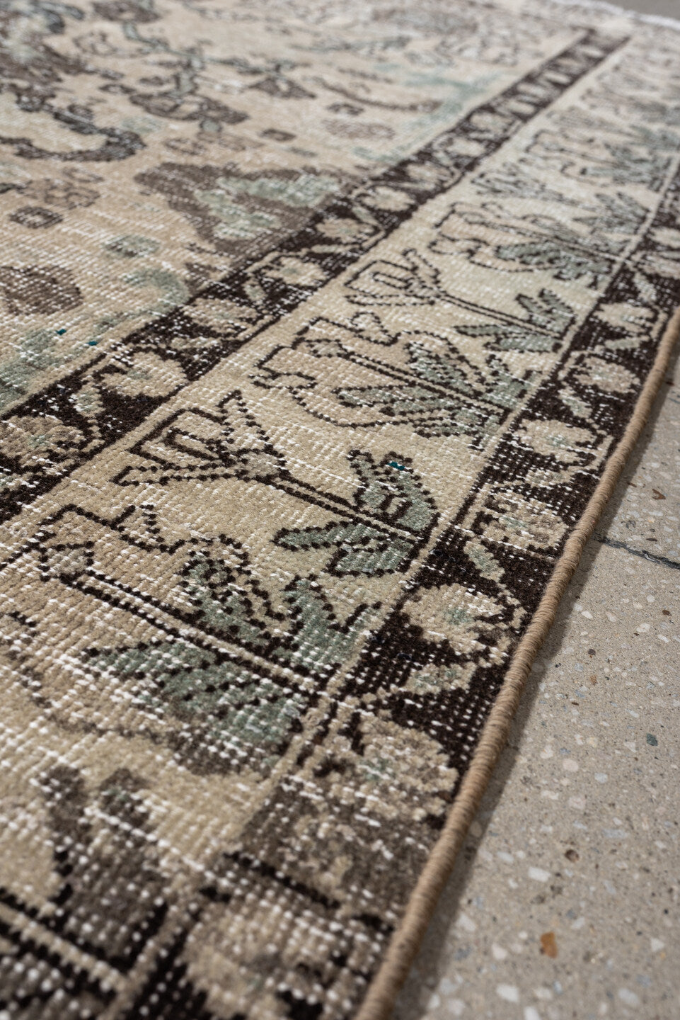 5' x 6' one-of-a-kind handmade vintage Baktiary rug. Color palette: ivory, charcoal, taupe, pale aqua, sage, beige, black