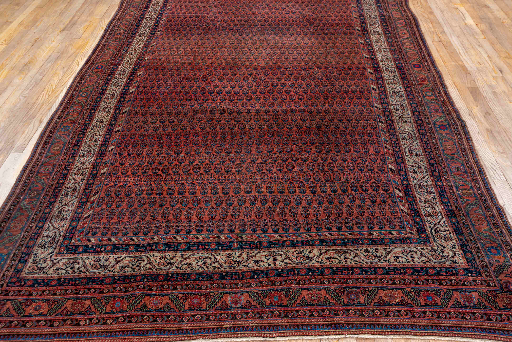 7' x 15' one-of-a-kind handmade antique Saraband rug. Color palette: rust, navy, ivory, terra cotta, charcoal, camel
