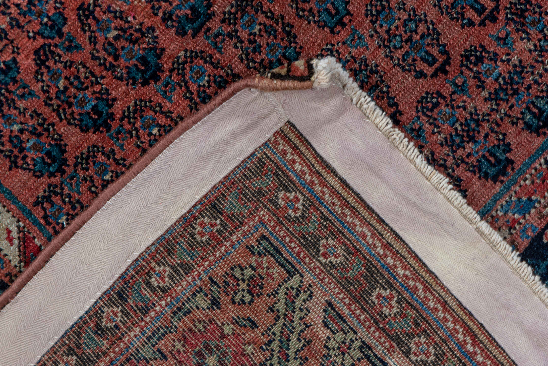 7' x 15' one-of-a-kind handmade antique Saraband rug. Color palette: rust, navy, ivory, terra cotta, charcoal, camel
