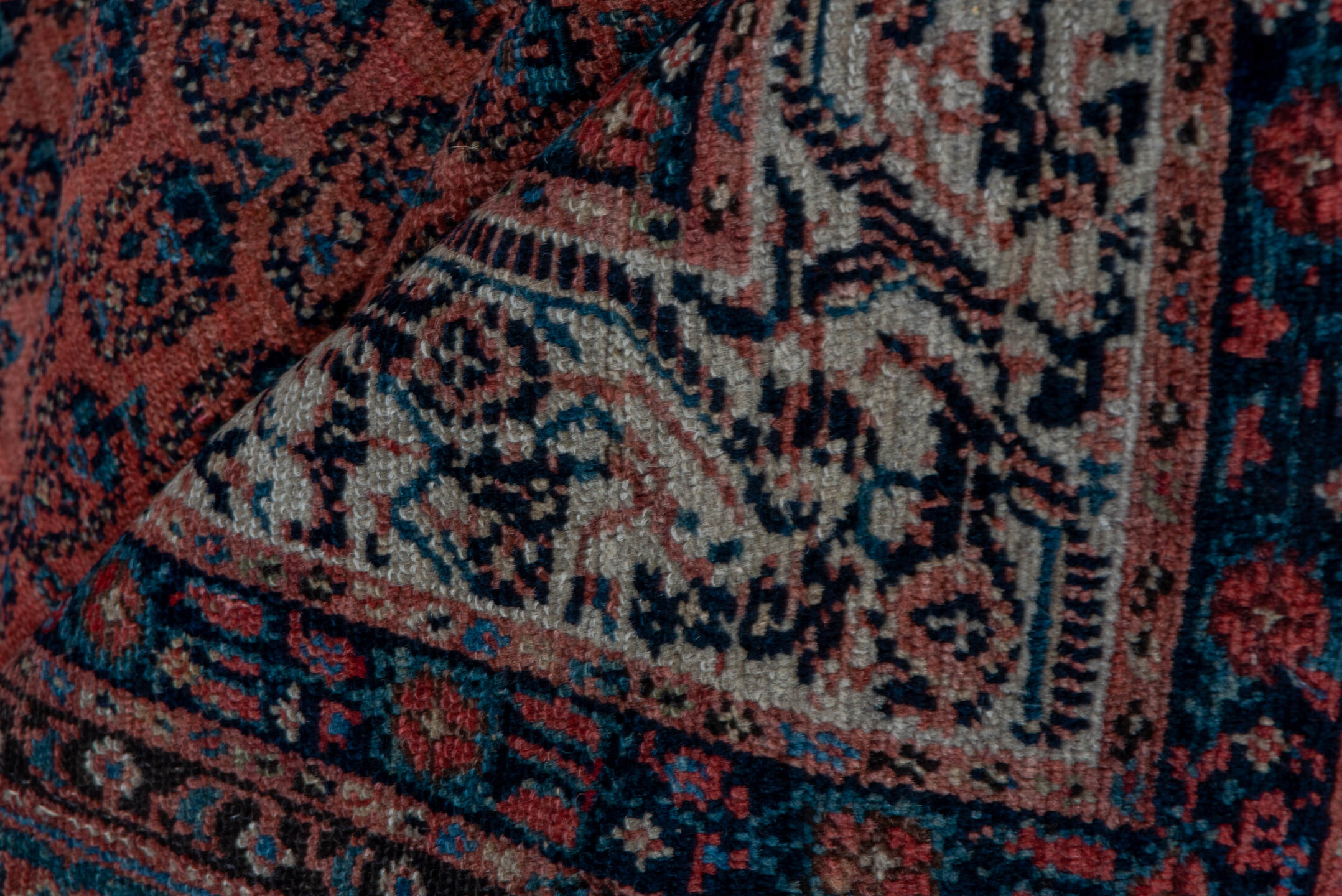 7' x 15' one-of-a-kind handmade antique Saraband rug. Color palette: rust, navy, ivory, terra cotta, charcoal, camel