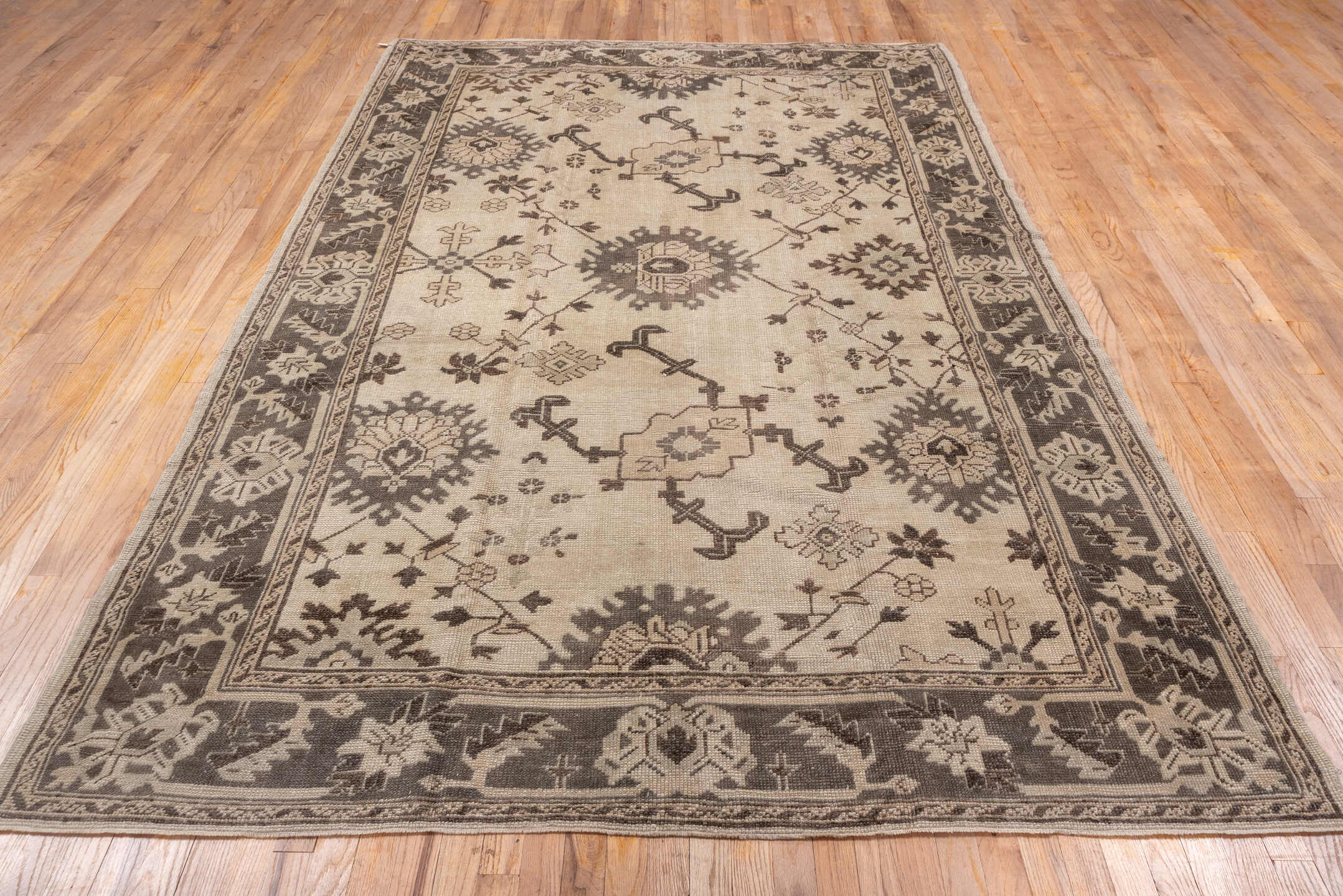 6' x 10' one-of-a-kind handmade antique Oushak large size rug. Color palette: ivory, taupe, brown, camel, beige, gray