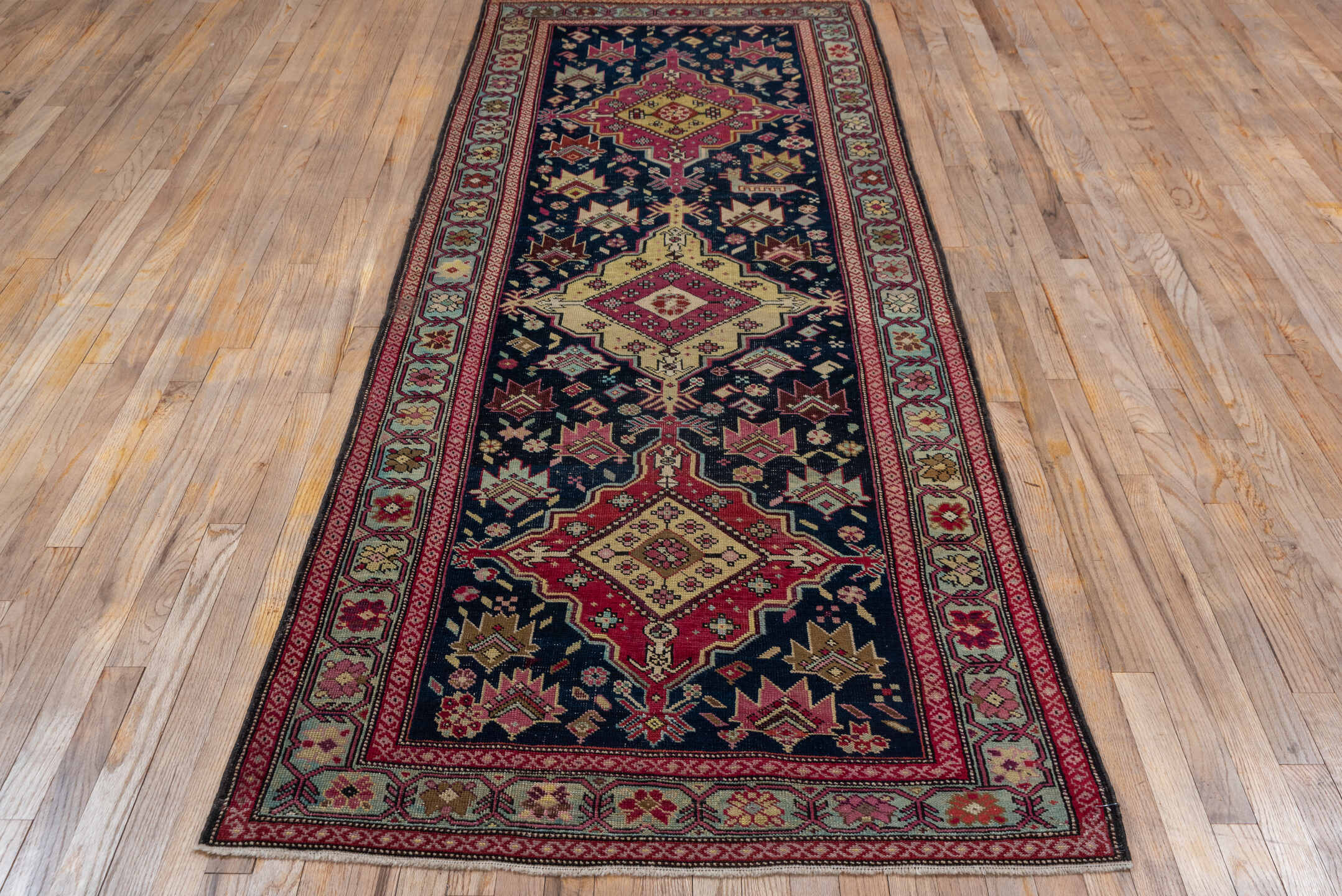 3' x 9' one-of-a-kind handmade antique Karabagh runner rug. Color palette: navy, crimson, ivory, gold, rose, taupe, burgundy