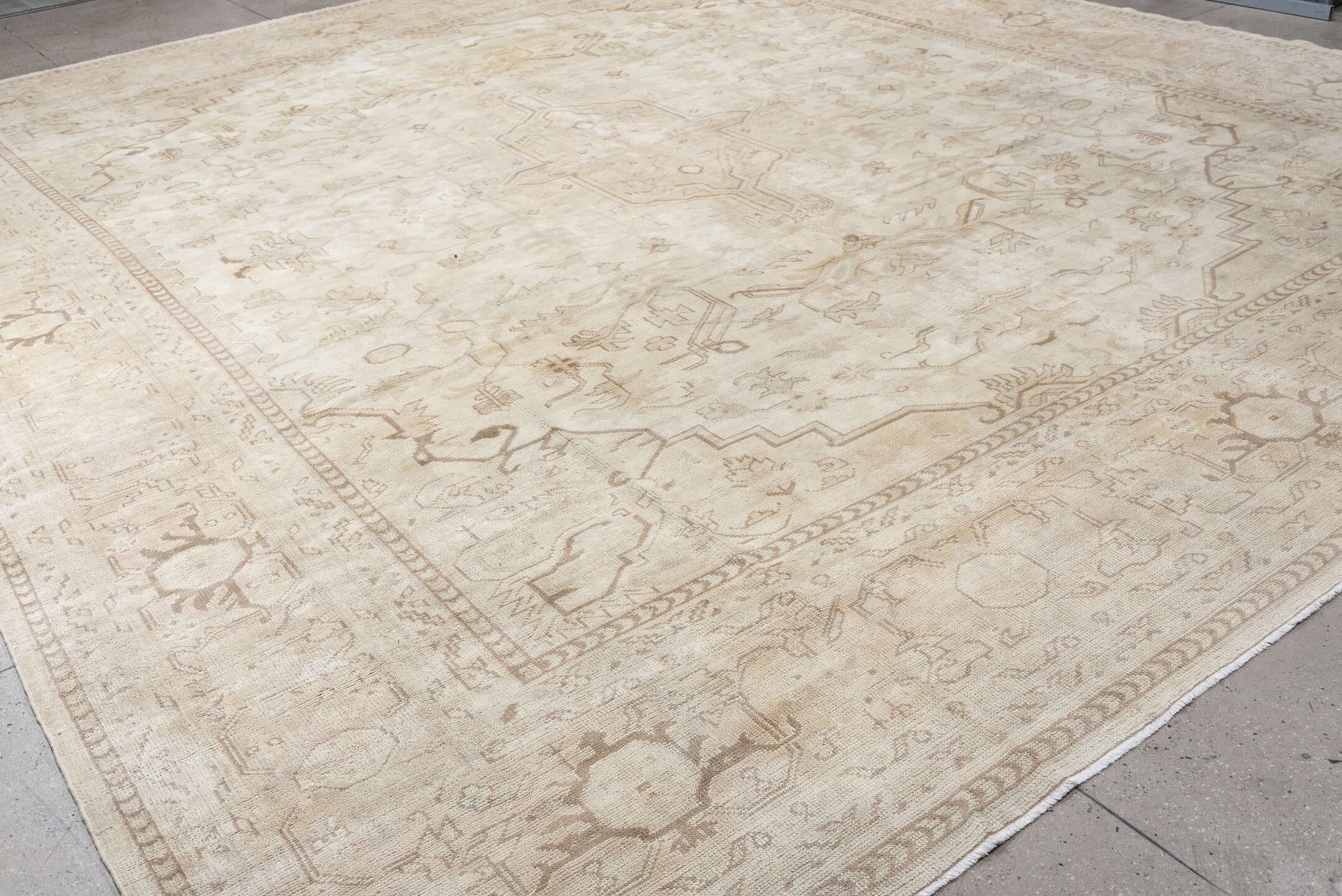 14' x 17' one-of-a-kind handmade antique Oushak oversize rug. Color palette: ivory, taupe, camel, brown, pale blue, beige