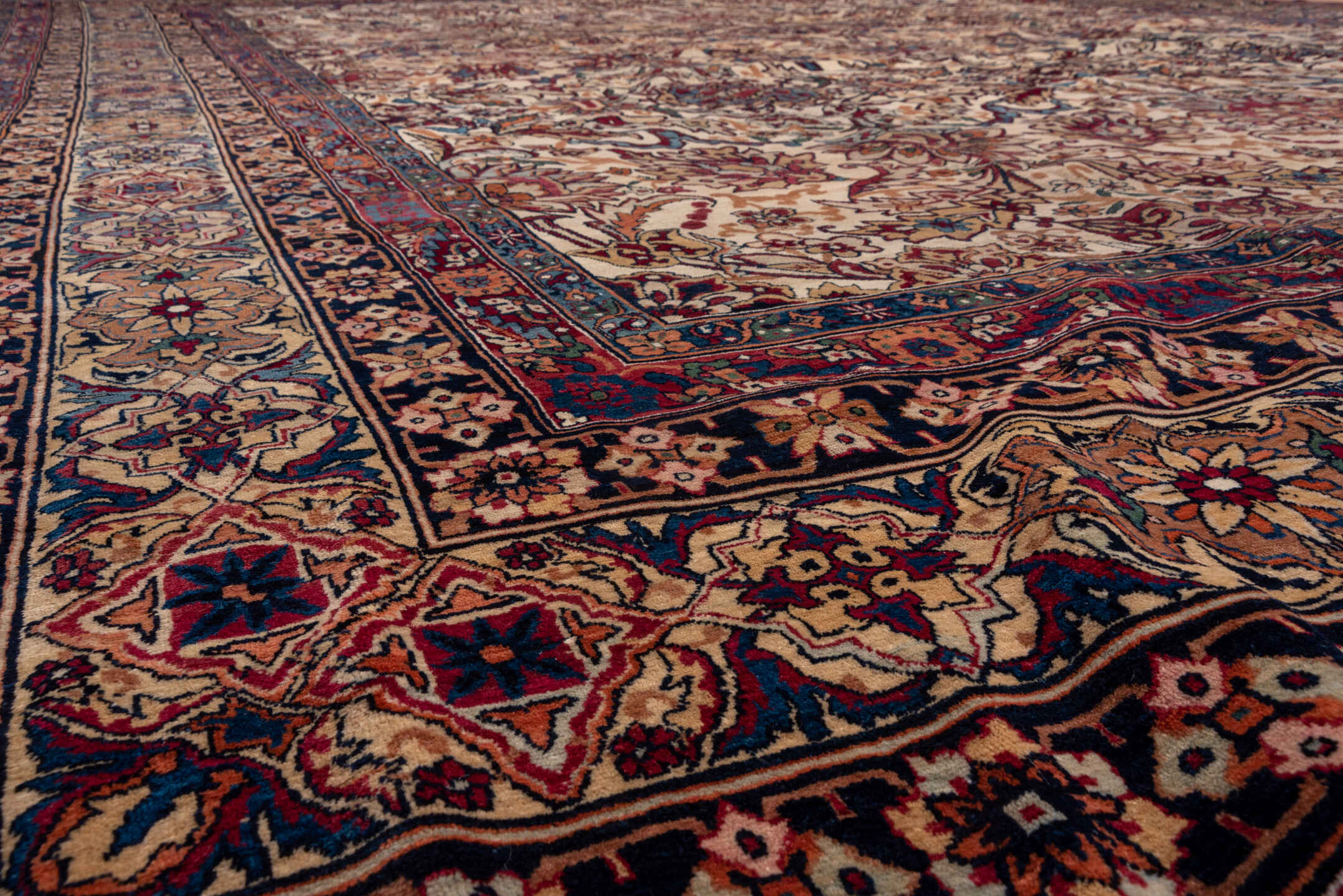 11' x 15' one-of-a-kind handmade antique Lavar oversize rug. Color palette: ivory, indigo, rust, burgundy, camel, navy, rose