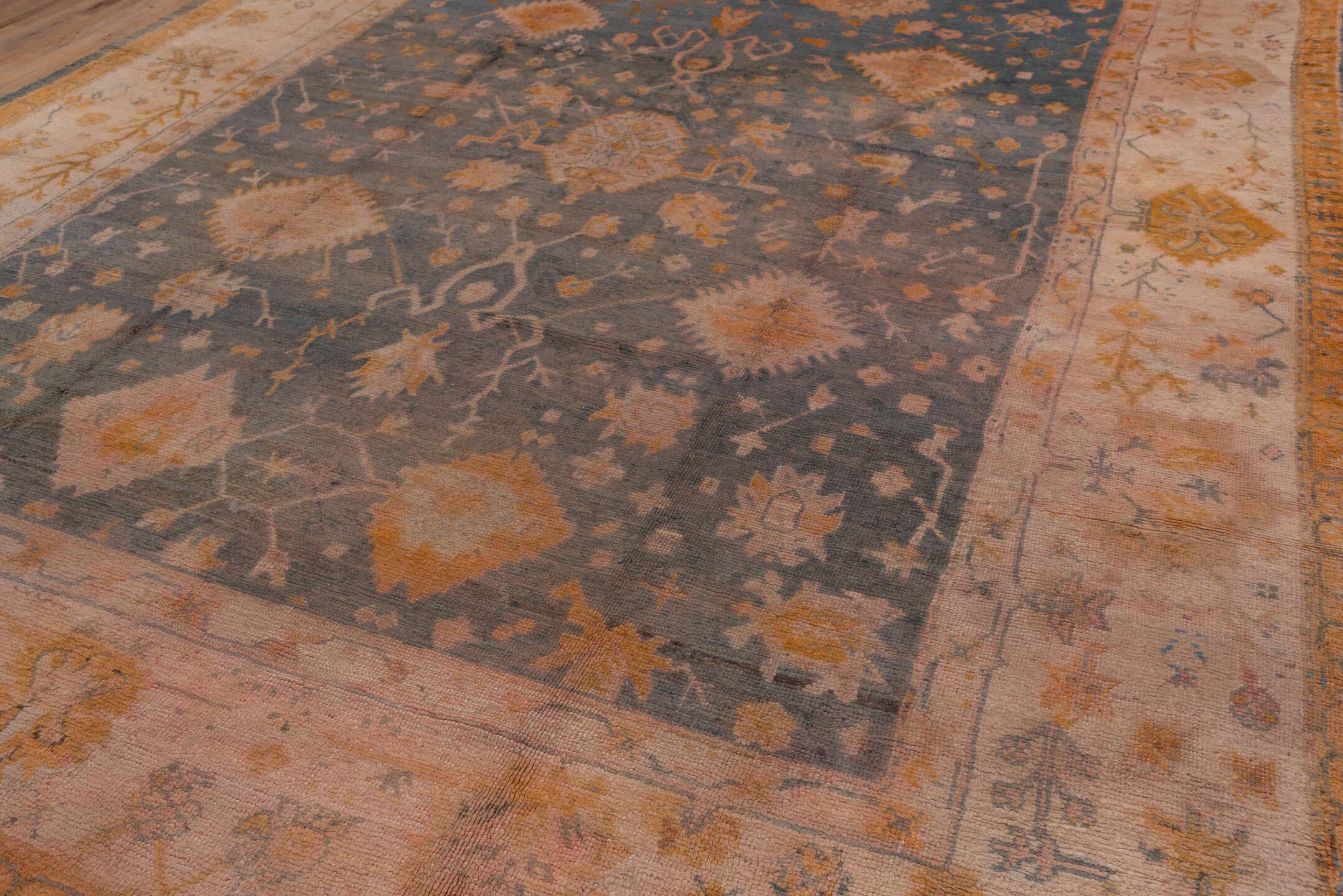 11' x 14' one-of-a-kind handmade antique Oushak oversize rug. Color palette: ivory, slate, gold, peach, taupe, saffron