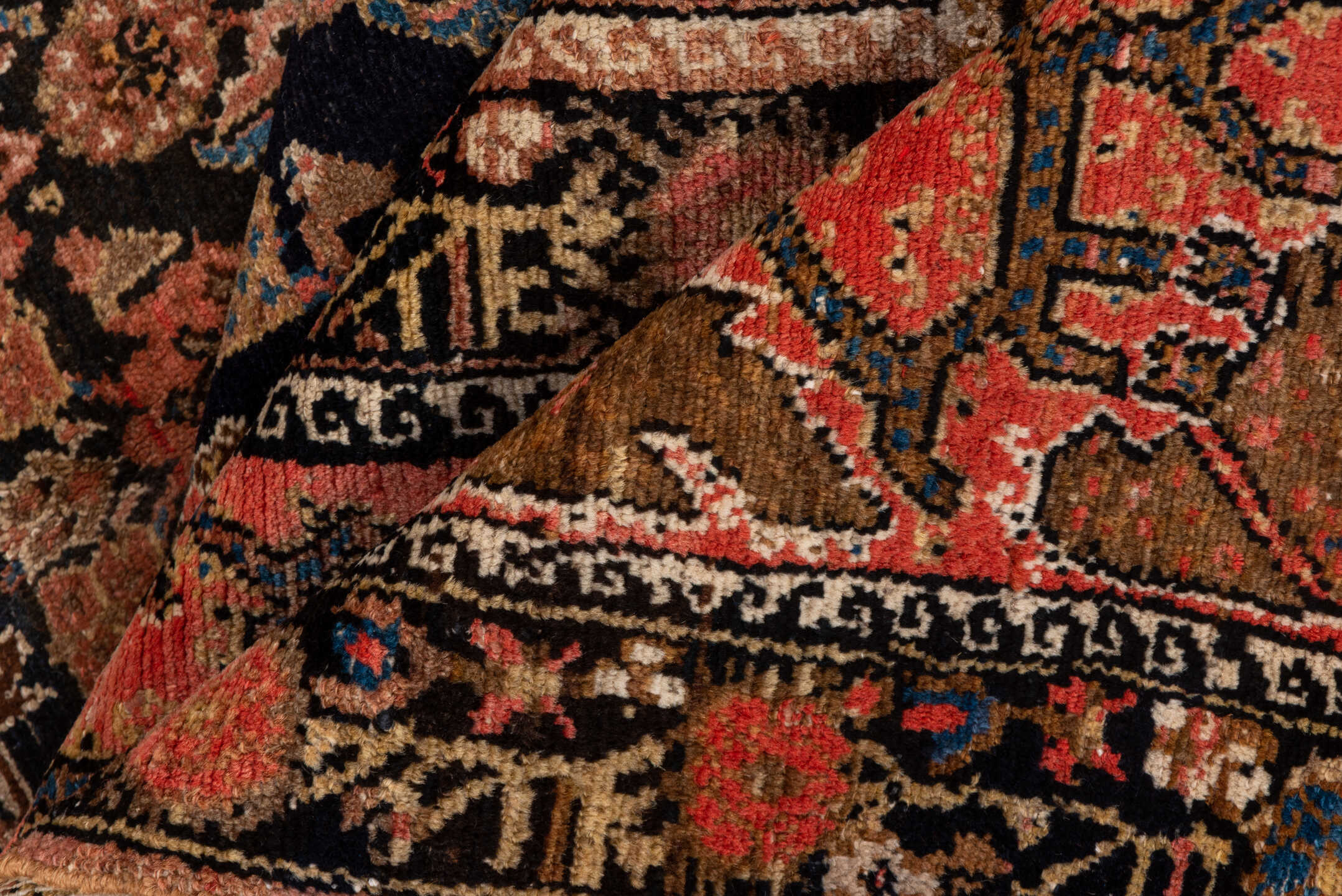 4' x 10' one-of-a-kind handmade vintage Malayer runner rug. Color palette: black, blue, brown, charcoal, gray, pink, red