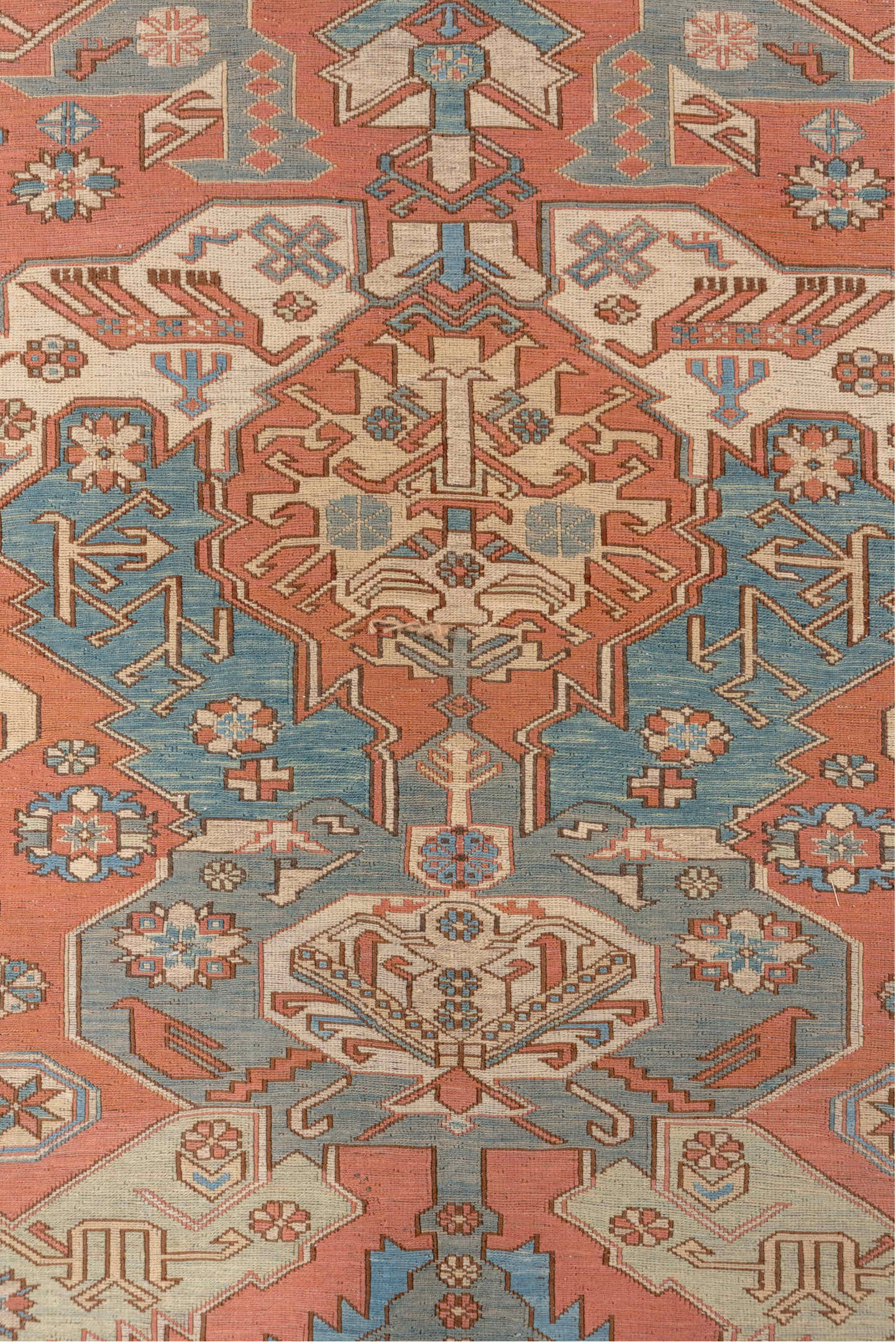 7' x 9' one-of-a-kind handmade vintage Sumak rug. Color palette: salmon, ivory, dusty blue, taupe, rust, beige, pink, blue